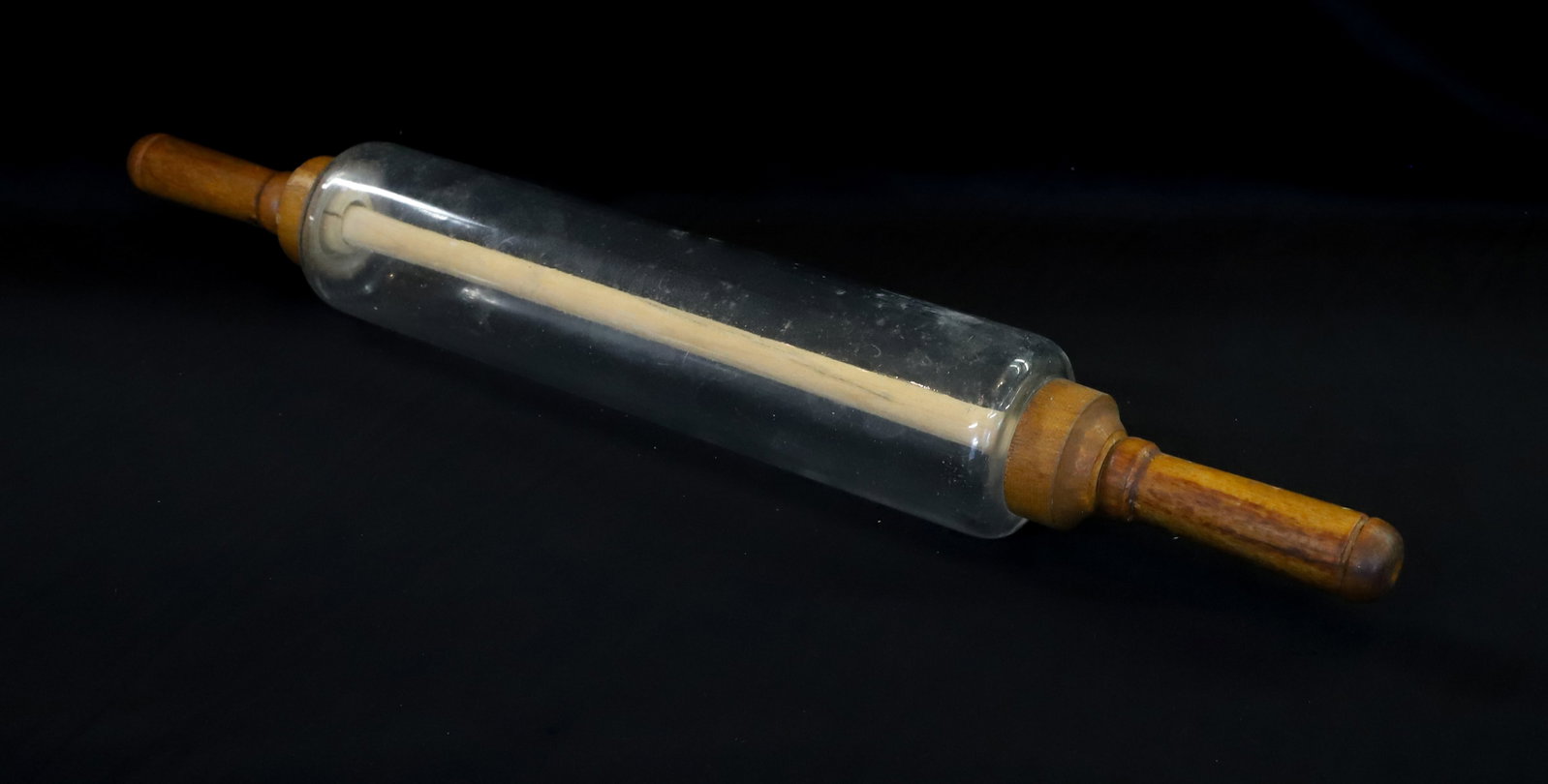VINTAGE GLASS/WOOD ROLLING PIN: WOODEN HANDLES ATTACHED WITH DOWEL. 21 1/2" L. EMBOSSED ON EDGE "IMPERIAL MFG. CO. 1921"