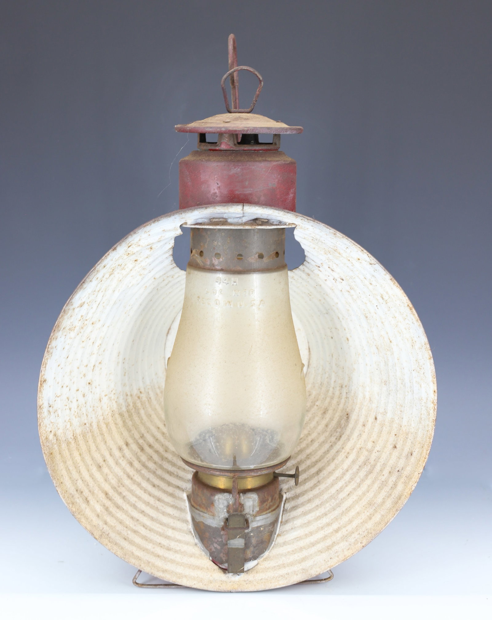 ANTIQUE RAILROAD SIGNAL LANTERN: RED PAINTED SURFACE WITH CLEAR EMBOSSED GLOBE (DIETZ). TOP MRKD. "MADE IN USA". 14 1/2" X 12".