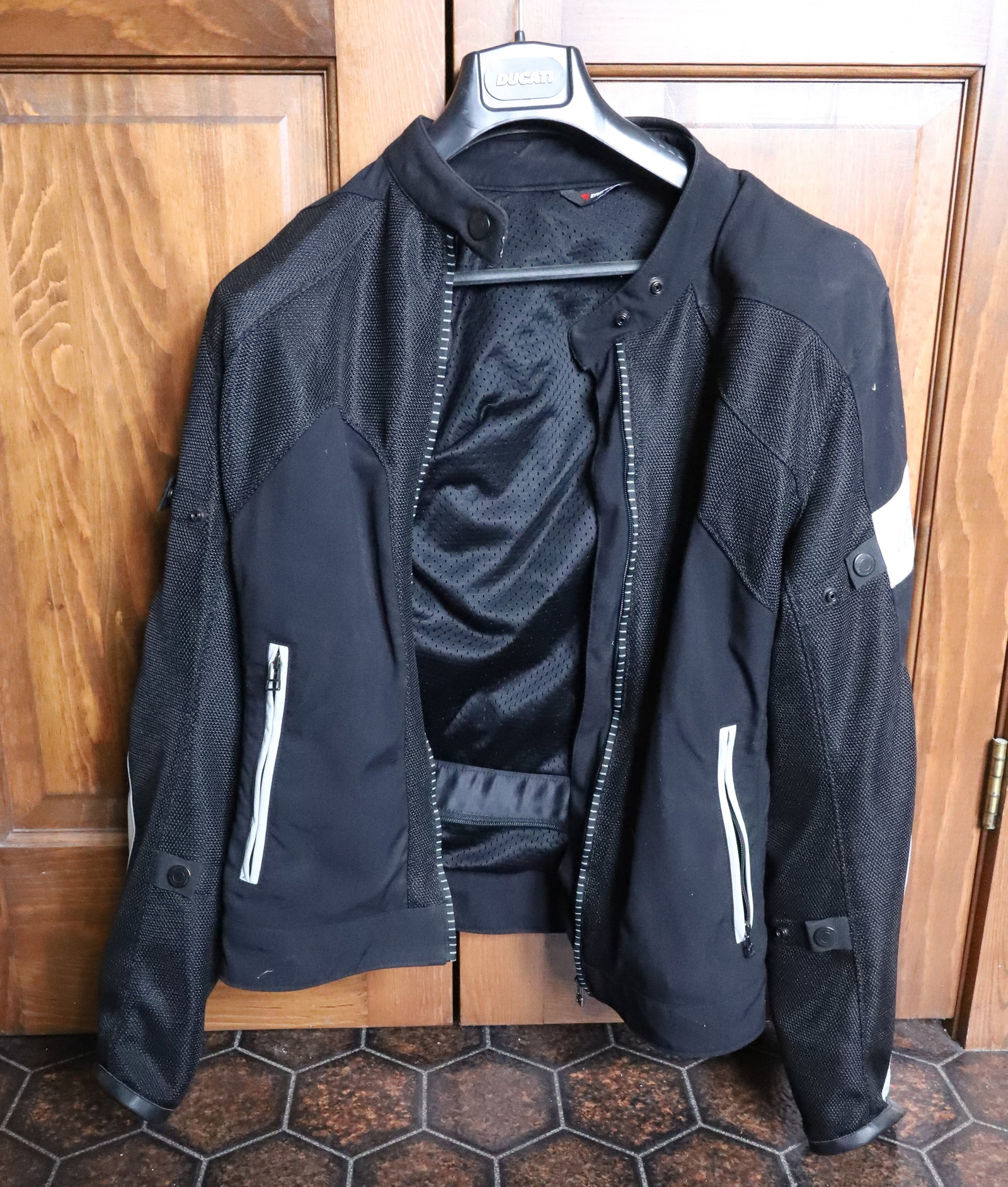 MOTORCYCLE GEAR: DUCATI LEATHER JACKET BY DAINESE SIZE 54 AND REVIT ENGINEERED SKIN PLEASE READ CAREFULLY. THIS IS AN ONLINE ONLY AUCTION. PICK-UP WILL TAKE PLACE AT THE LOCATION OF THE AUCTION AT 1570 HARBOURTON