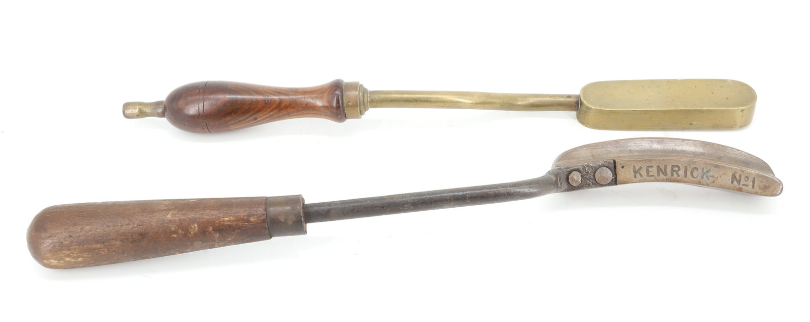 (2) UNUSUAL HAT IRONS: INCLUDING: KENRICK #1 AND BRASS UNUSUAL FORM IRON. 14 1/2" AND 14" L. PLEASE READ CAREFULLY - ITEMS MUST BE PAID FOR THROUGH LIVE AUCTIONEERS OR WITH CASH OR CHECK IN PERSON - Terms for Purchasing