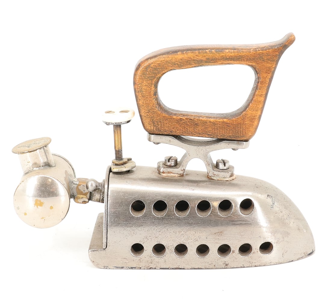 OMEGA SMALL SIZE FUEL IRON: REAR TANK MRKD. OMEGA WITH MOTHER-OF-PEARL DECORATED STEM. SAWBUCK HANDLE, RETICULATED SIDES. 5" L. PLEASE READ CAREFULLY - ITEMS MUST BE PAID FOR THROUGH LIVE AUCTIONEERS OR WITH CASH OR CHECK IN