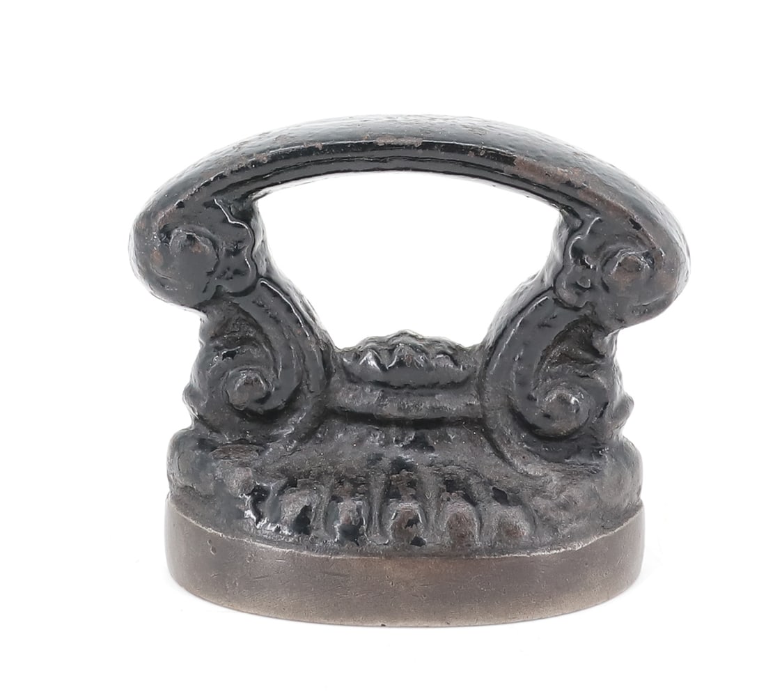 FRENCH CAP IRON: SMALL SIZE WITH BLACK PAINTED SURFACE. SMOOTH BOTTOM. 3 1/8" L. PLEASE READ CAREFULLY - ITEMS MUST BE PAID FOR THROUGH LIVE AUCTIONEERS OR WITH CASH OR CHECK IN PERSON - Terms for Purchasing and