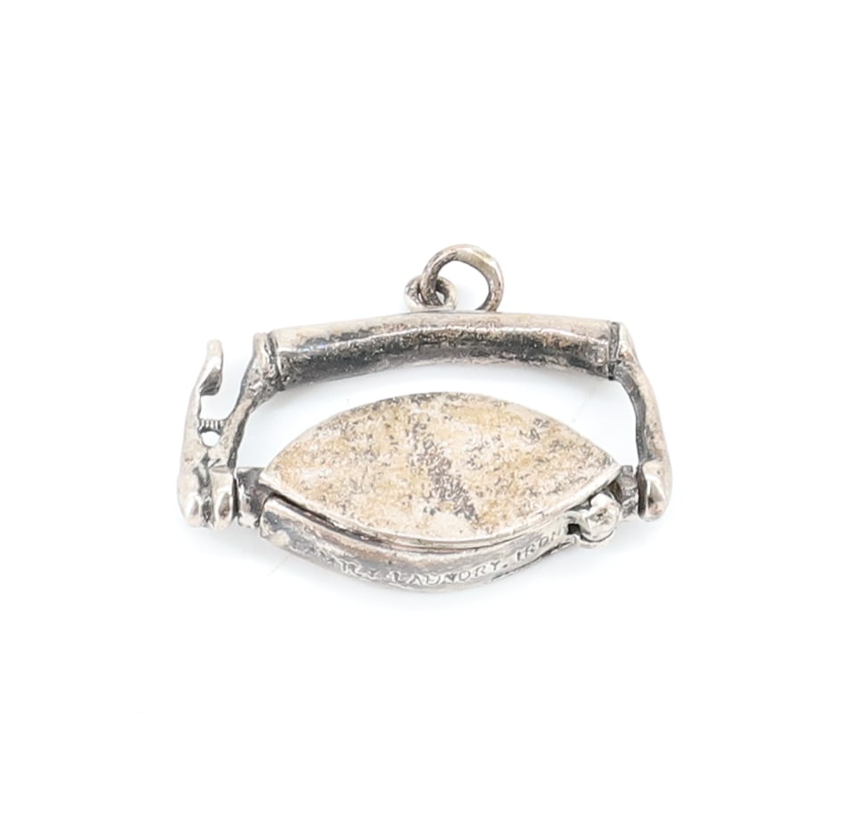 STERLING SILVER IRON CHARM: REVOLVING IRON, CARVER-STYLE CHARM. PLEASE READ CAREFULLY - ITEMS MUST BE PAID FOR THROUGH LIVE AUCTIONEERS OR WITH CASH OR CHECK IN PERSON - Terms for Purchasing and Shipping of Auction Items. Please