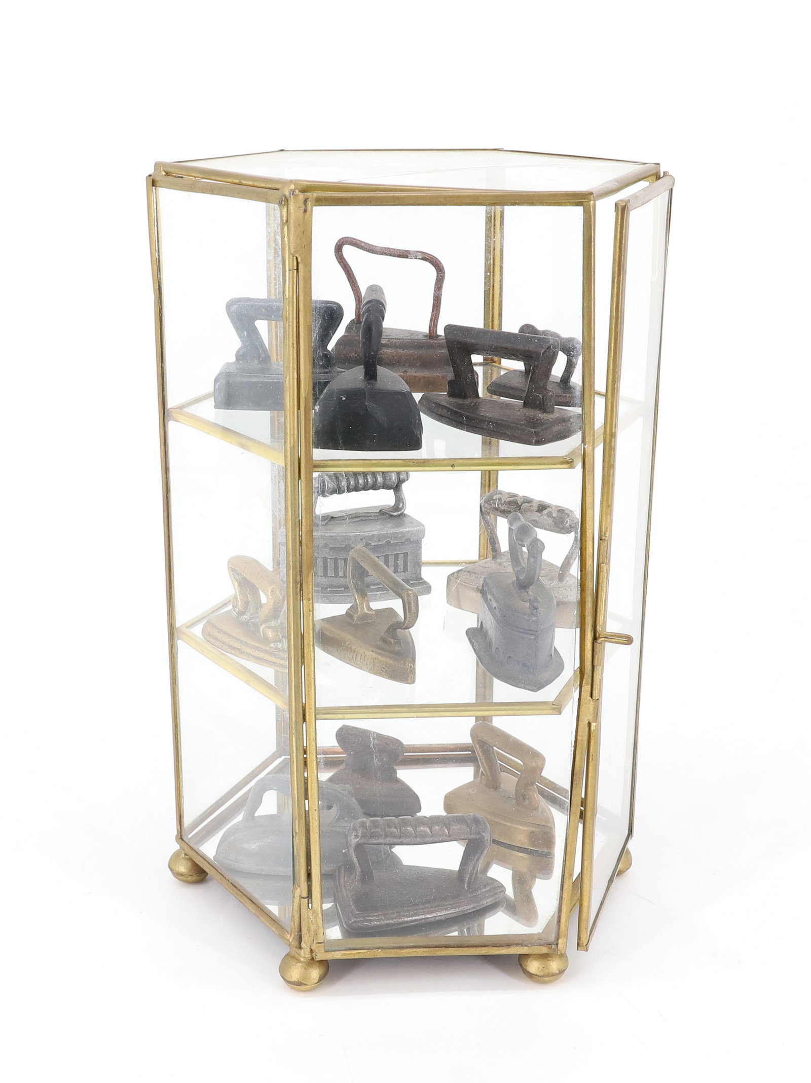 MINIATURE IRON COLLECTION AND DISPLAY: (14) MINIATURE IN VARIOUS METALS AND TYPES. IN GLASS/BRASS DISPLAY CASE. PLEASE READ CAREFULLY - ITEMS MUST BE PAID FOR THROUGH LIVE AUCTIONEERS OR WITH CASH OR CHECK IN PERSON - Terms for Purchasing 