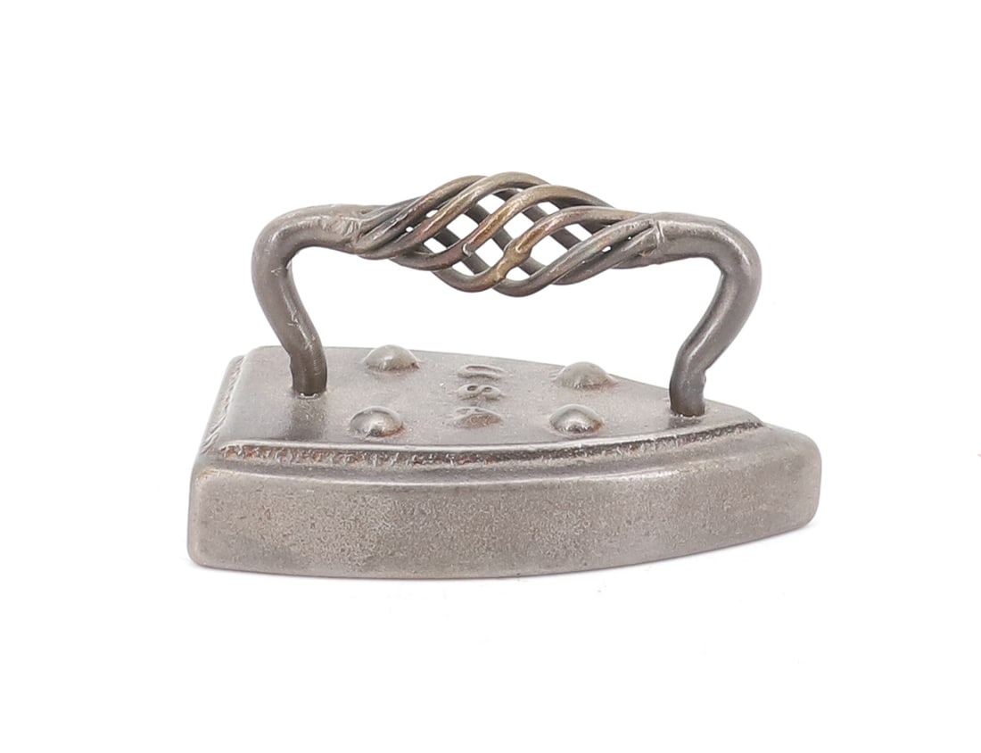 UNUSUAL HANDLE MINIATURE IRON: TWISTED OPENWORK HANDLE. EMBOSSED "U.S.A." ON BODY. 3 3/4" L. PLEASE READ CAREFULLY - ITEMS MUST BE PAID FOR THROUGH LIVE AUCTIONEERS OR WITH CASH OR CHECK IN PERSON - Terms for Purchasing and Shippin