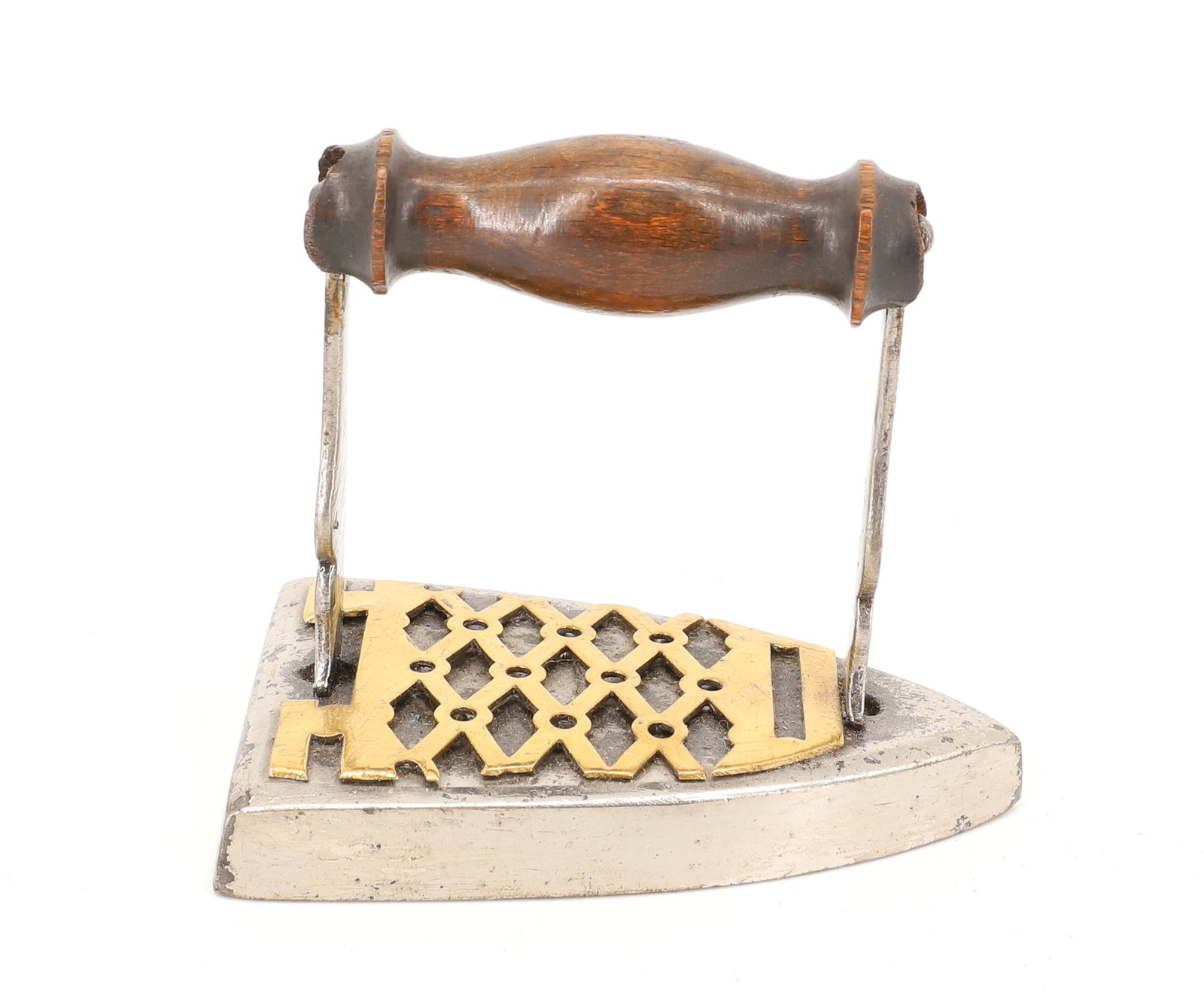 MINIATURE IRON / BRASS PRESSING IRON: BRASS CUT-OUT APPLIED TO TOP OF BODY. WITH SHAPELY FLAT POSTS. TURNED WOODEN GRIP. 3" X 3 3/8". PLEASE READ CAREFULLY - ITEMS MUST BE PAID FOR THROUGH LIVE AUCTIONEERS OR WITH CASH OR CHECK IN PERSON 