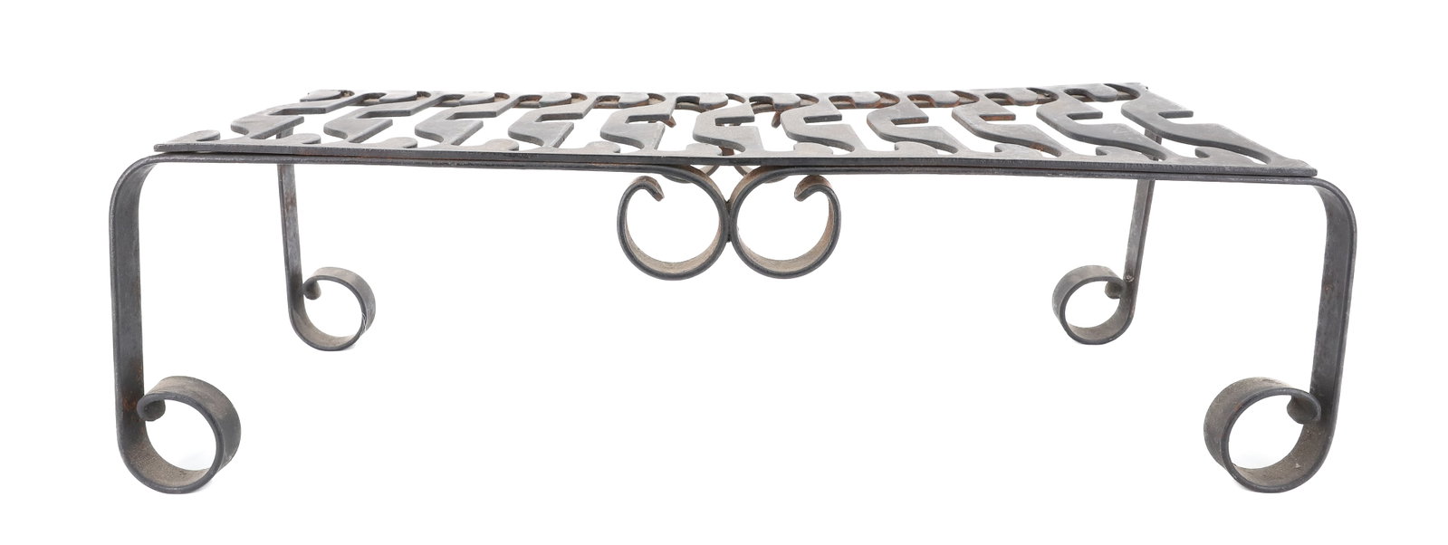 LARGE IRON TRIVET: WROUGHT IRON BASE WITH CUT-OUT DESIGN TOP. 5 3/4" X 18 1/2" X 7 1/2". PLEASE READ CAREFULLY - ITEMS MUST BE PAID FOR THROUGH LIVE AUCTIONEERS OR WITH CASH OR CHECK IN PERSON - Terms for Purchasing and