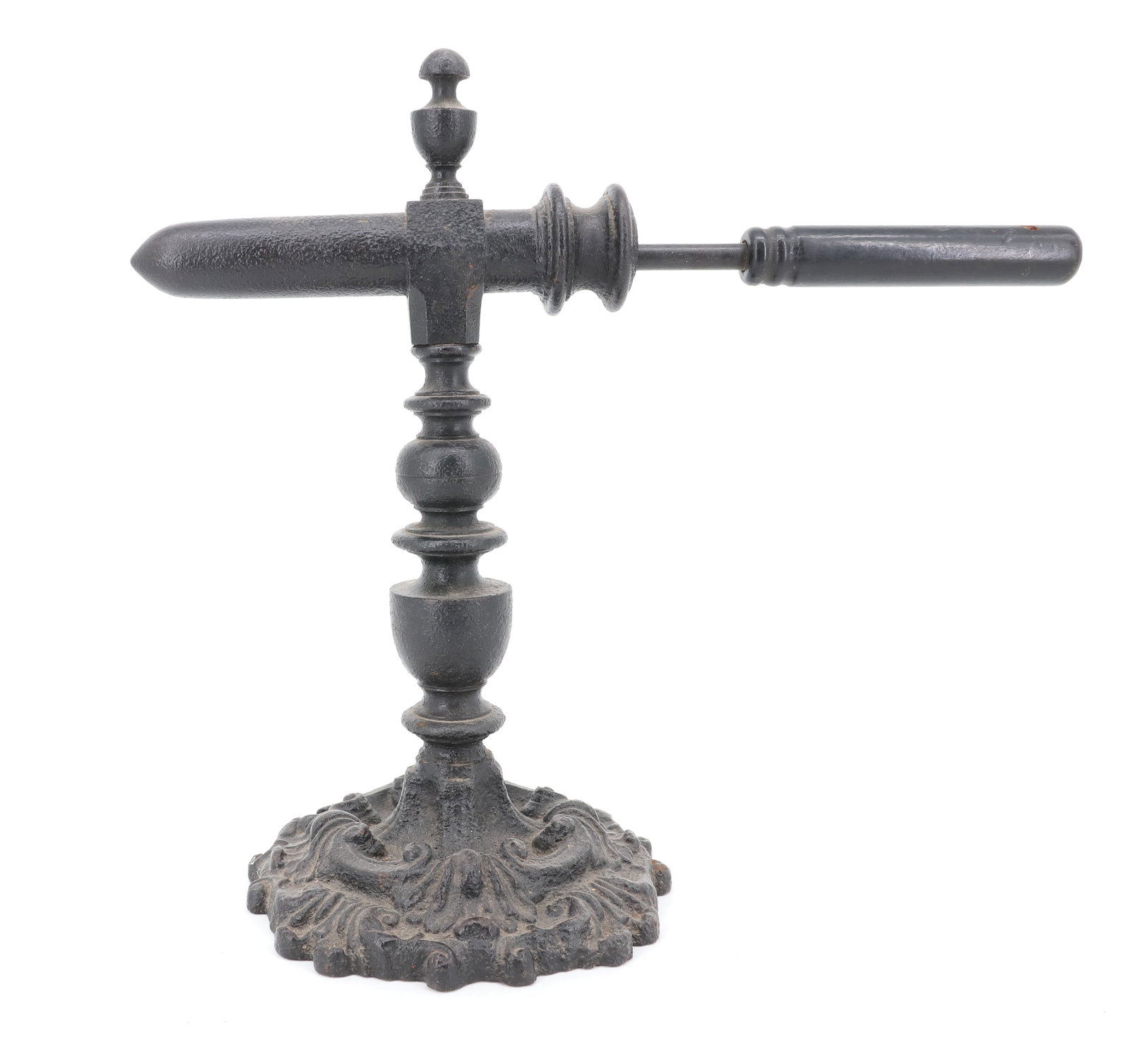 ORNATE CAST IRON GOFFERING IRON: SINGLE BARREL (7" L) ON TURNED POST WITH ORNATE ROUND BASE. URN FINIAL. WITH HEAT ROD. 12 1/2" H. BARREL IS PLEASE READ CAREFULLY - ITEMS MUST BE PAID FOR THROUGH LIVE AUCTIONEERS OR WITH CASH OR CHEC