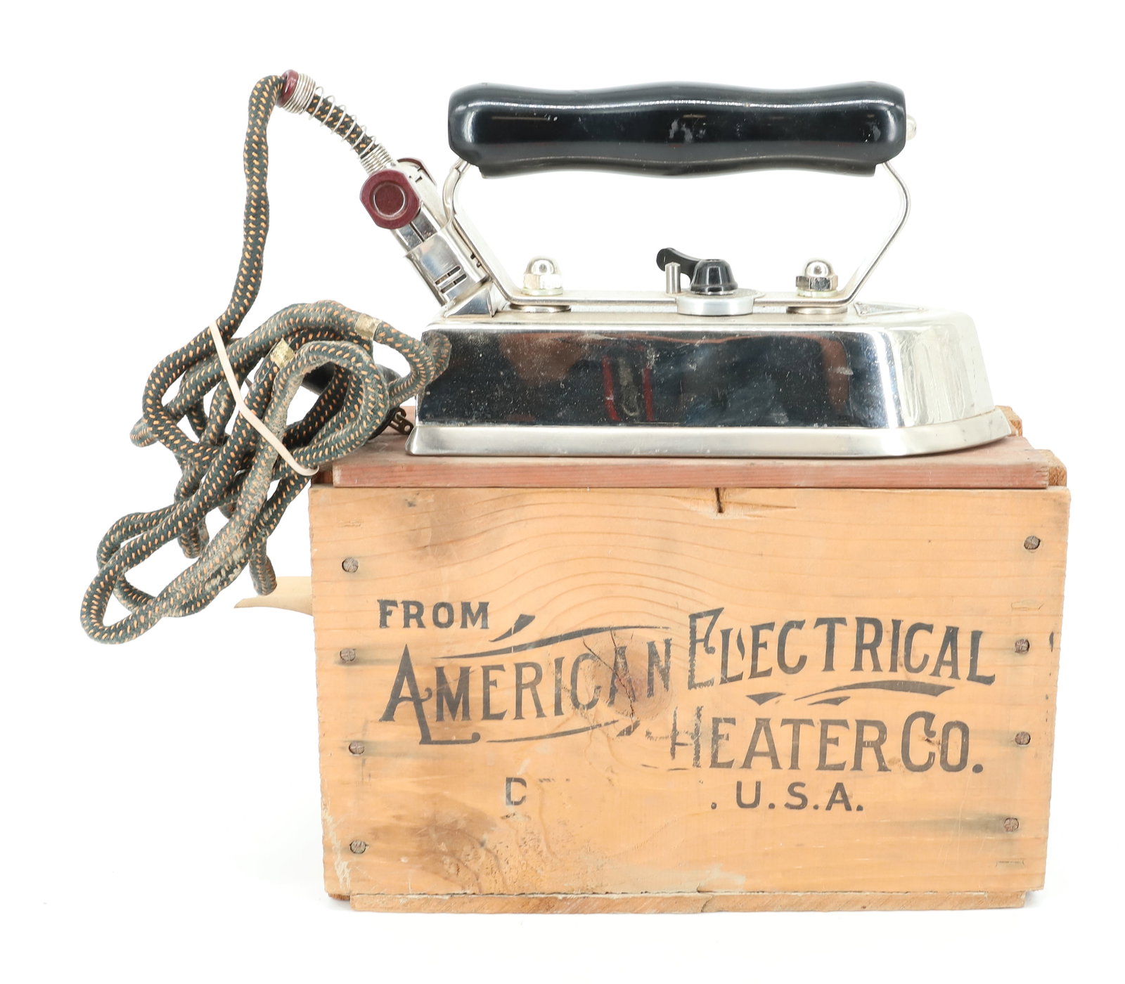 THE AMERICAN BEAUTY PRESSING IRON: AUTOMATIC ELECTRIC IRON WITH ORIGINAL WOODEN BOX AND PAPER LABEL. BOX IS 12" L. PLEASE READ CAREFULLY - ITEMS MUST BE PAID FOR THROUGH LIVE AUCTIONEERS OR WITH CASH OR CHECK IN PERSON - Terms for