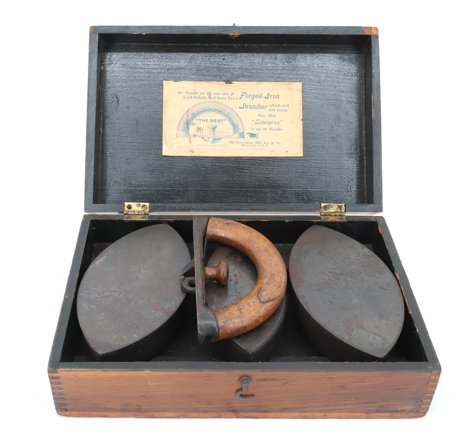 ENTERPRISE SAD IRONS IN ORIGINAL WOODEN BOX: (3) SAD IRON BASES WITH DETACHABLE WOODEN HANDLE. BOX IS 12" L. PLEASE READ CAREFULLY - ITEMS MUST BE PAID FOR THROUGH LIVE AUCTIONEERS OR WITH CASH OR CHECK IN PERSON - Terms for Purchasing and