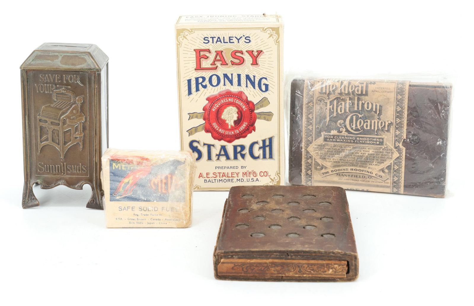 LOT OF IRONING AND LAUNDRY ITEMS: INCLUDING: BRASS "SAVE FOR YOUR SUNNYSUDS" BANK 4 5/8" H. (2) IRON CLEANERS (THE IDEAL FLAT IRON CLEANER) STAHLEY'S EASY IRONING STARCH BOX AND "META" SAFE SOLID FUEL TABLETS. PLEASE READ CAREFULLY -