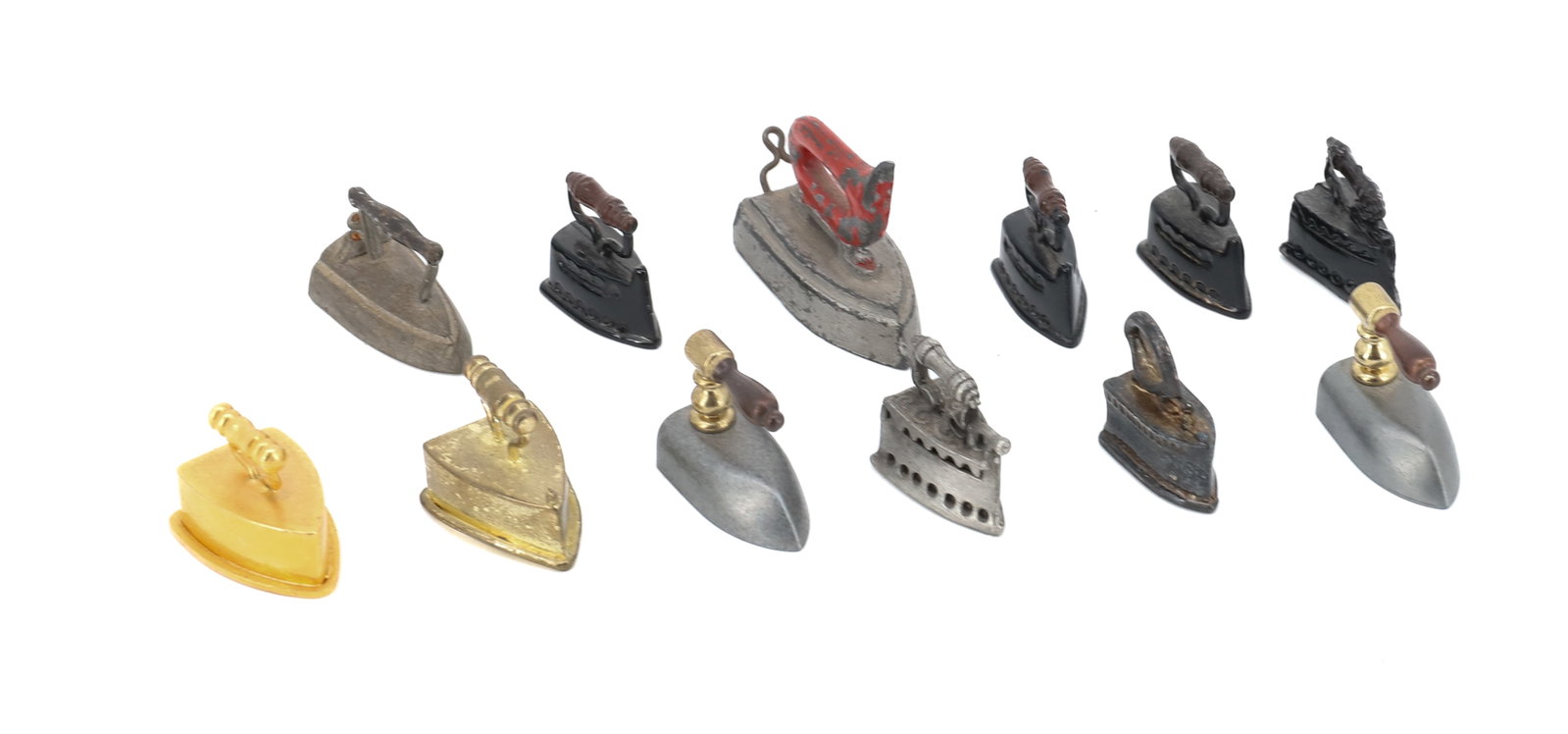 (12) MINIATURE PRESSING IRONS: VARIOUS STYLES, MATERIALS AND SIZES. 3/4" TO 1 1/2" LENGTHS. PLEASE READ CAREFULLY - ITEMS MUST BE PAID FOR THROUGH LIVE AUCTIONEERS OR WITH CASH OR CHECK IN PERSON - Terms for Purchasing and
