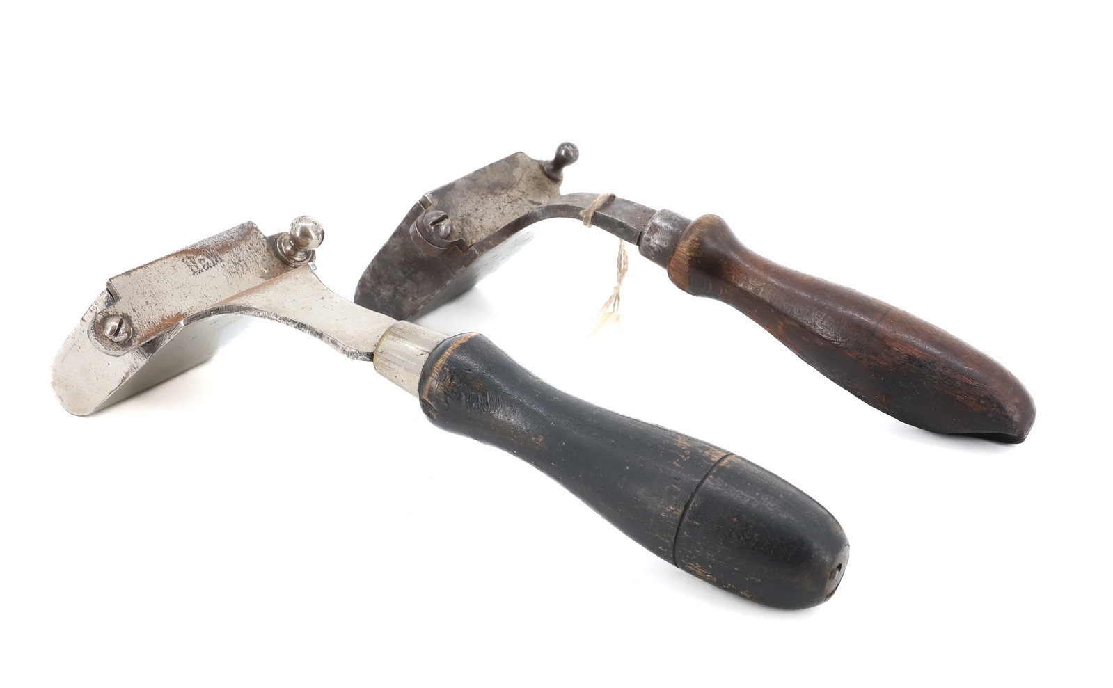 (2) ANTIQUE HAT IRONS: NICKEL-FINISH OVER CAST IRON WITH INTERIOR SLUG. MRKD. "H&M" ON SWIVEL DOOR. 9" L. WITH, HAT IRON TAGGED "GLISSMAN #340" 8 1/4" L. PLEASE READ CAREFULLY - ITEMS MUST BE PAID FOR THROUGH LIVE