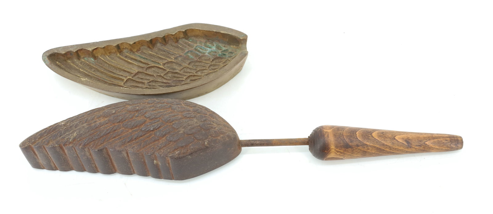 UNUSUAL FEATHER WING HAT IRON: WING FORM WITH INDIVIDUAL FEATHER DESIGN. BRASS AND IRON. 13 1/4" L. PLEASE READ CAREFULLY - ITEMS MUST BE PAID FOR THROUGH LIVE AUCTIONEERS OR WITH CASH OR CHECK IN PERSON - Terms for Purchasing and 
