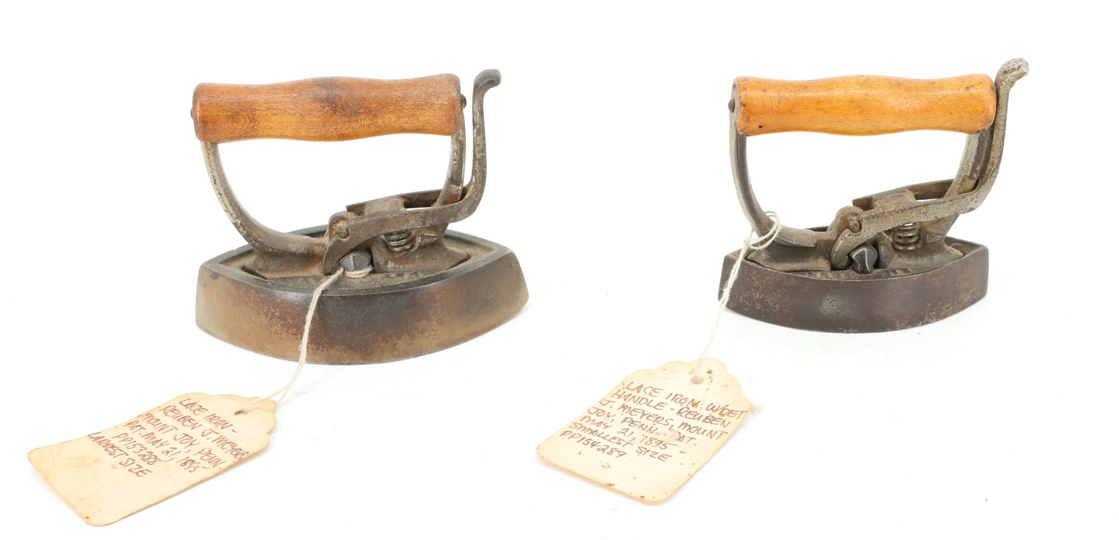 PAIR OF MEYERS LACE IRONS: DOUBLE-POINT DESIGN WITH DETACHABLE HANDLES. LARGEST AND SMALLEST SIZES. EARLY LABELS. 4 1/8" AND 3 3/8". PLEASE READ CAREFULLY - ITEMS MUST BE PAID FOR THROUGH LIVE AUCTIONEERS OR WITH CASH OR CHECK