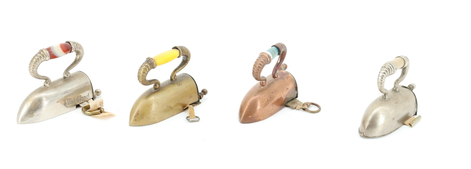 LOT OF (4) MINIATURE OX-TONGUE TAPE MEASURES: INCLUDING: COPPER, BRASS AND TIN. ONE MRKD. WILDBAD WITH SWIRLED HAND GRIP. GLASS INSERTS. TAPE PULLS OUT AND HANDLE ON BACK WINDS BACK IN. 2" L. THIMBLE IN ONE. PLEASE READ CAREFULLY - ITEMS MUST BE 