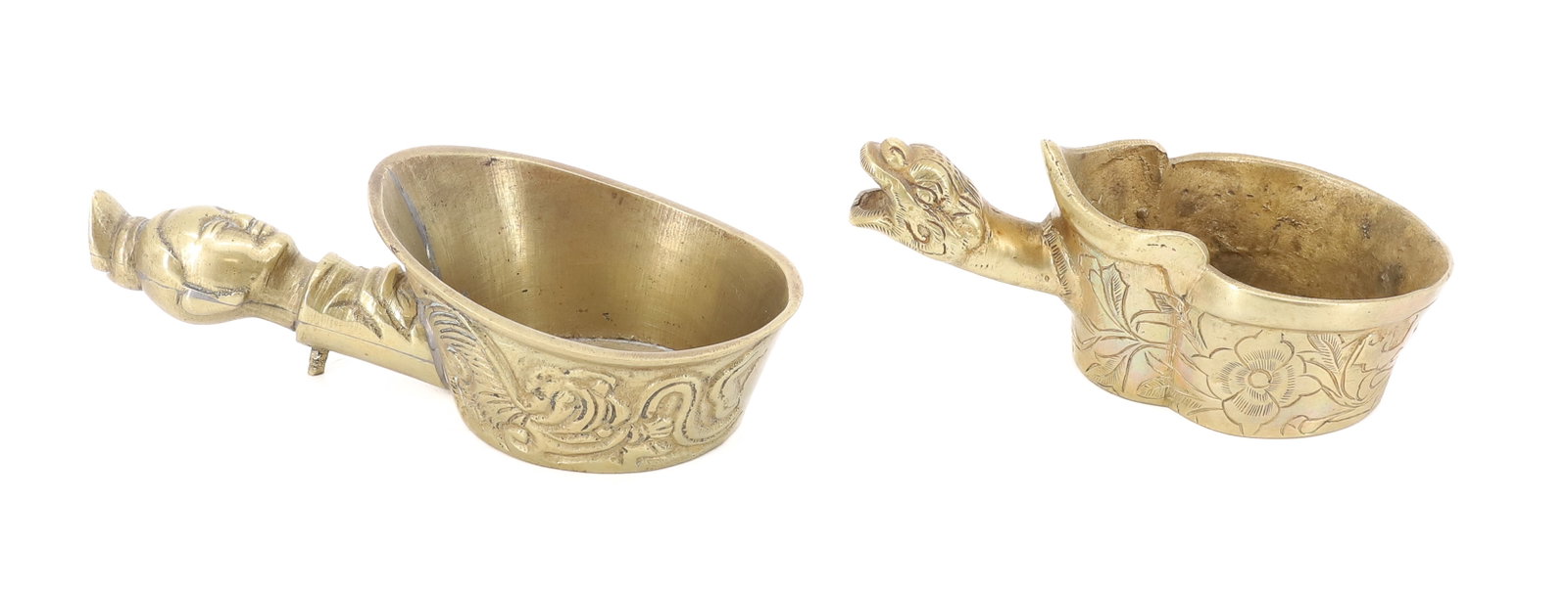 (2) FIGURAL BRASS PAN IRONS: TWO CHINESE PAN IRONS. ONE WITH HUMAN HEAD AND OTHER WITH DRAGON HEAD. FLORAL AND VINE DECORATED SIDES. 5" AND 5 1/2" LENGTHS. PLEASE READ CAREFULLY - ITEMS MUST BE PAID FOR THROUGH LIVE AUCTIONEERS O