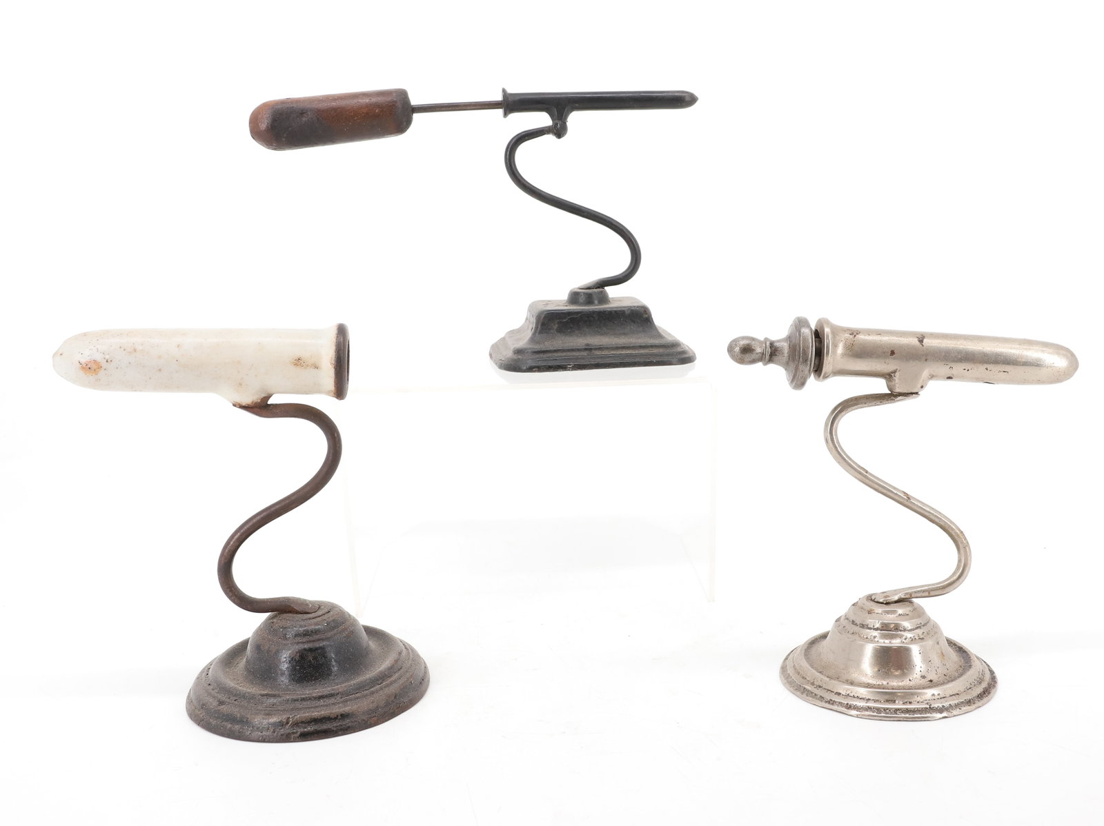(3) SMALL SIZE GOFFERING IRONS: SINGLE BARREL IRONS WITH "S" POSTS. PAINTED SURFACES. ONE WITH PORCELAIN ENAMEL BARREL. TWO HAVE HEAT RODS. 4" TO 4 1/2" BARRELS. PLEASE READ CAREFULLY - ITEMS MUST BE PAID FOR THROUGH LIVE AUCTIONEER