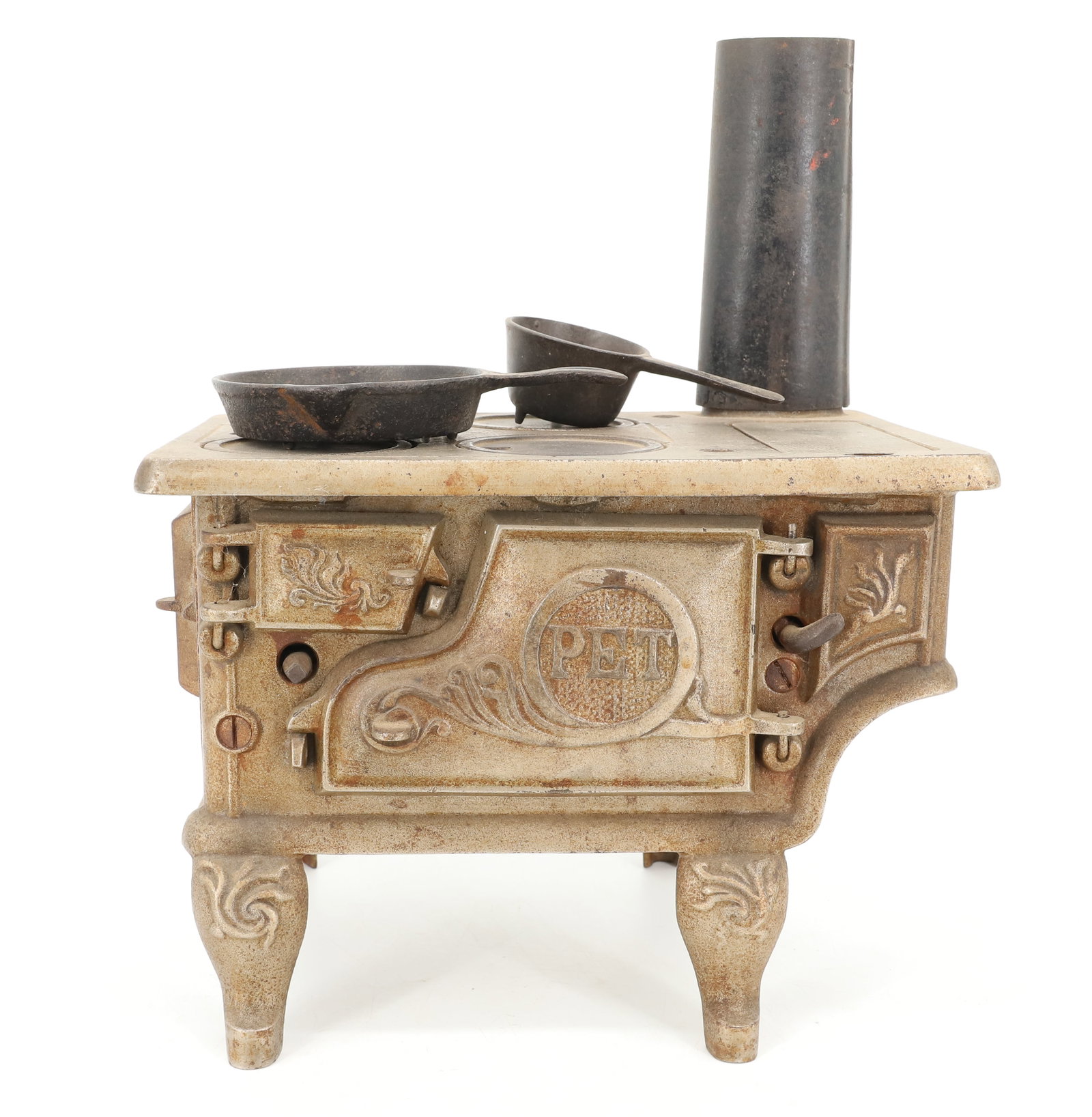 CAST IRON TOY STOVE: 4 BURNER TOP, MARKED; PET ON DOOR, INCLUDES; POT AND FRY PAN WITH SMOKE STACK - 6 1/2" X 9" X 6" PLEASE READ CAREFULLY - ITEMS MUST BE PAID FOR THROUGH LIVE AUCTIONEERS OR WITH CASH OR CHECK IN
