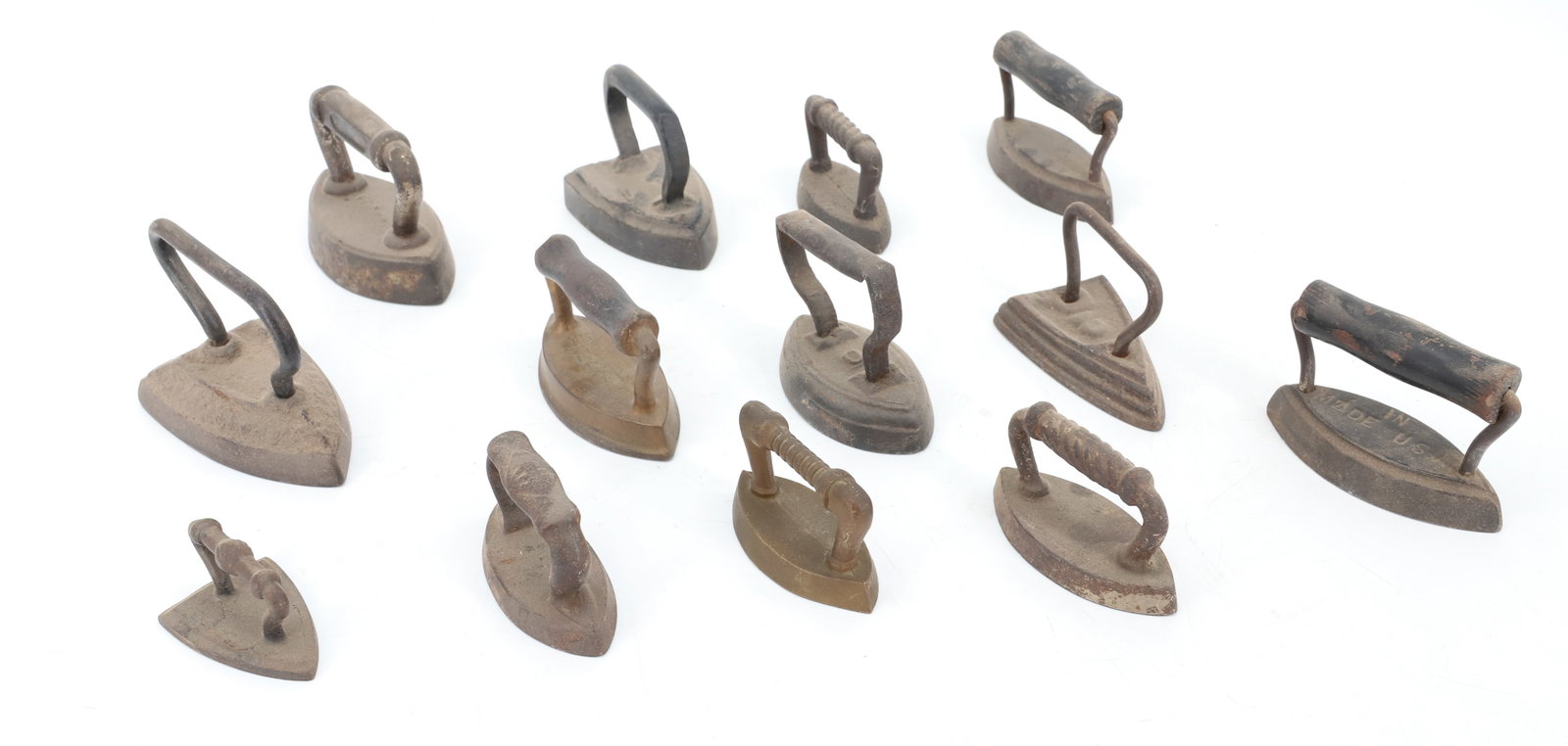 LOT OF (13) MINIATURE SAD IRONS: INCLUDING: FLAT IRONS, DOUBLE-POINT. 2 1/2" TO 3 1/2". PLEASE READ CAREFULLY - ITEMS MUST BE PAID FOR THROUGH LIVE AUCTIONEERS OR WITH CASH OR CHECK IN PERSON - Terms for Purchasing and Shipping of