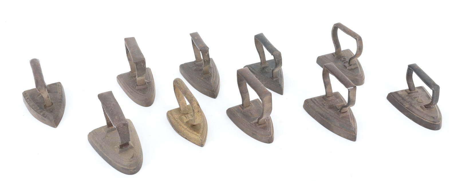 LOT OF (10) MINIATURE SAD IRONS: INCLUDING: NUMBERED AND INITIALED EXAMPLES. 3" TO 3 1/4" LENGTHS. PLEASE READ CAREFULLY - ITEMS MUST BE PAID FOR THROUGH LIVE AUCTIONEERS OR WITH CASH OR CHECK IN PERSON - Terms for Purchasing and
