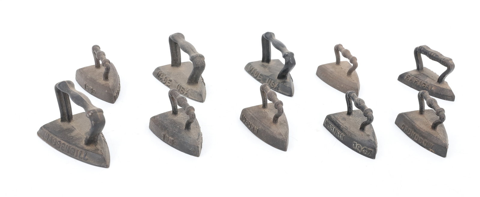 LOT OF (10) MINIATURE SAD IRONS: ALL HAVE EMBOSSED MARKINGS ON SIDES. "MADE IN USA", "MSW5", "1959 FERSAMMLING", "POT LUCK", "AUBURN" AND MORE. 2 1/2" TO 3" LENGTHS. PLEASE READ CAREFULLY - ITEMS MUST BE PAID FOR THROUGH LIVE AUCTION