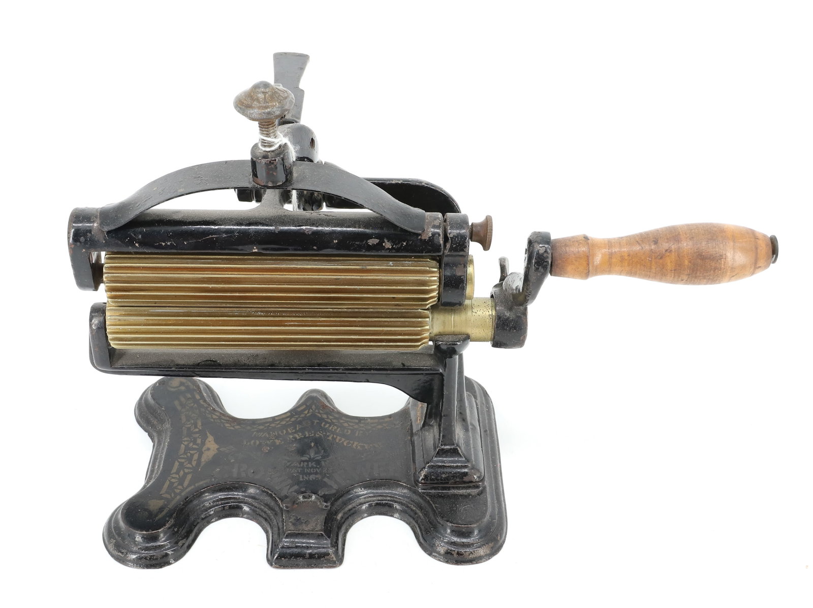 CROWN JEWEL FLUTING MACHINE: MANUFACTURED BY LOWERRE & TUCKER, NEWARK, NJ, PATENT 1860S. TRACES OF ORIGINAL PAINT AND STENCILING. 6" BRASS ROLLERS. PLEASE READ CAREFULLY - ITEMS MUST BE PAID FOR THROUGH LIVE AUCTIONEERS OR WITH C