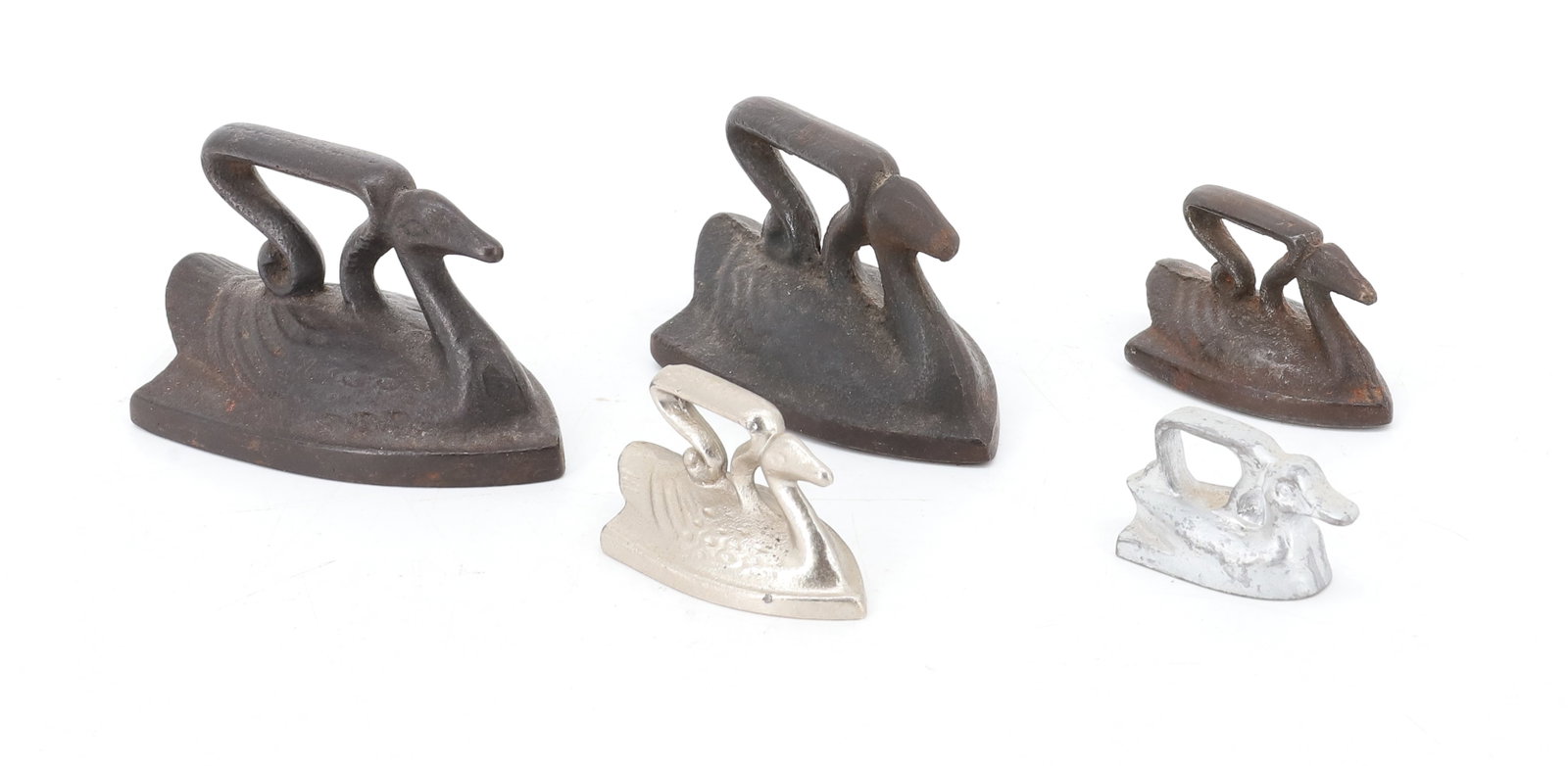 (5) TOY SWAN IRONS: TWO WITH SILVER PAINTED SURFACES. AND ONE IN FORM OF DUCK. 1 1/2" TO 3 1/2" LENGTHS. PLEASE READ CAREFULLY - ITEMS MUST BE PAID FOR THROUGH LIVE AUCTIONEERS OR WITH CASH OR CHECK IN PERSON - Terms for