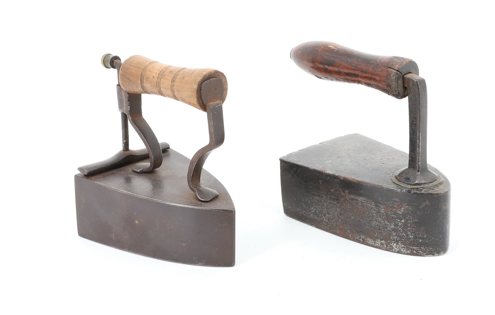 (2) 19TH C. SMALL SIZE BOX IRONS: INCLUDING: DROP IN BACK SLUG IRON WITH FRONT POSTS. SLUG IRON WITH REAR LIFT-GATE WITH APPLIED FOOTED POST HANDLE. INTERIOR SLUG. 4 1/2" L. PLEASE READ CAREFULLY - ITEMS MUST BE PAID FOR THROUGH LIVE 