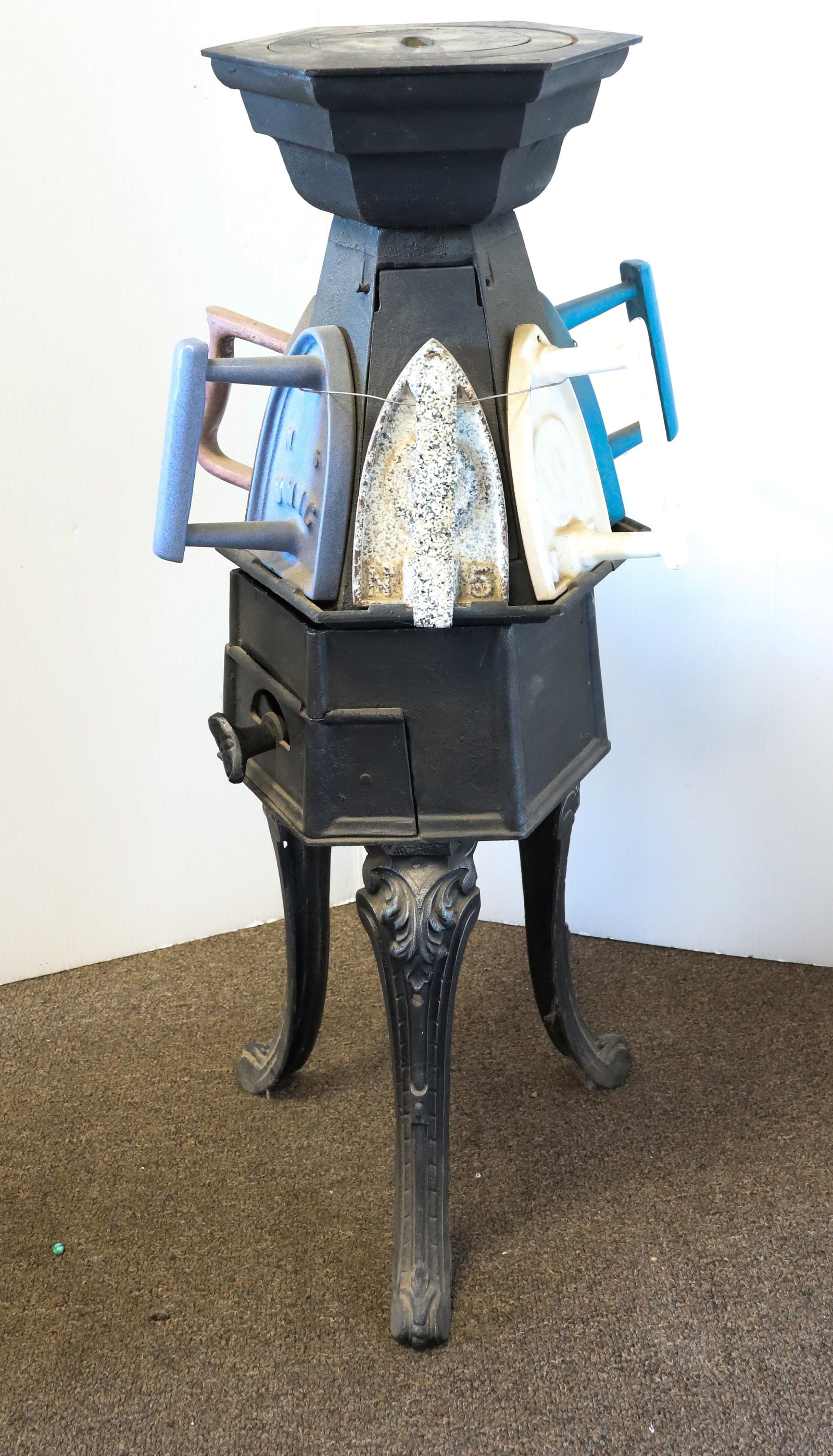 CAST IRON SIX-SIDED SAD IRON STOVE (1 of 4)