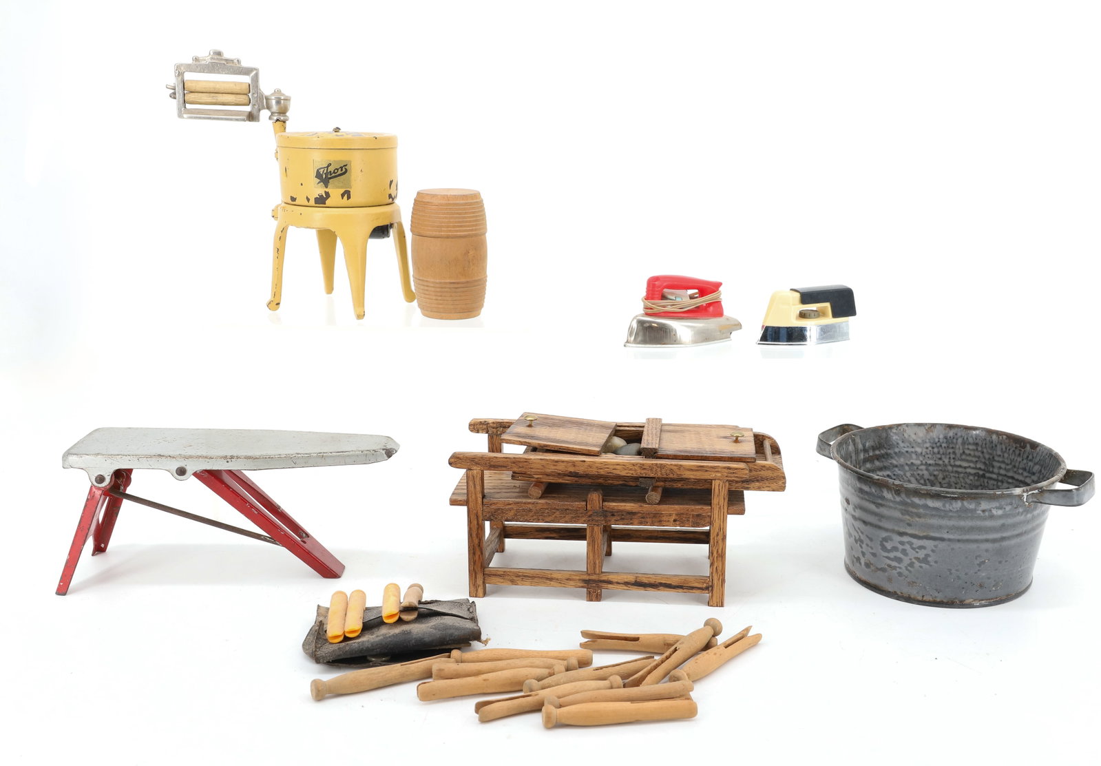 LOT OF CHILDREN'S TOYS, WASHING ITEMS: INCLUDING: IRONING BOARD / IRONS, AGATE WASH TUB, CLOTHES PINS, THOR WRINGER WASHER. WITH, WOODEN TOY ROCK MANGLER. PLEASE READ CAREFULLY - ITEMS MUST BE PAID FOR THROUGH LIVE AUCTIONEERS OR WITH CASH