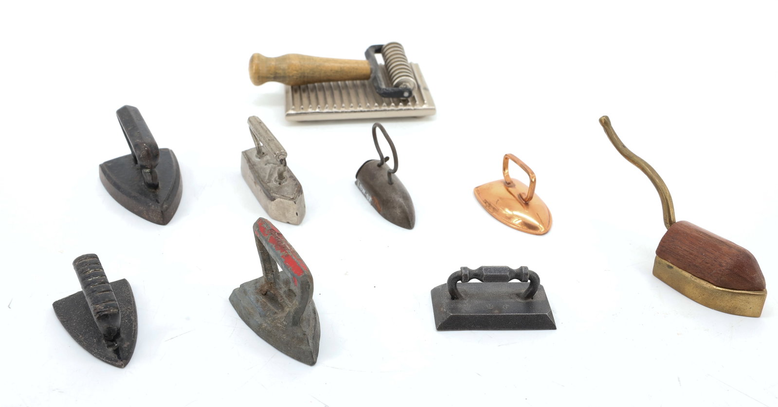 LOT OF MINIATURE AND TOY IRONS: (8) INCLUDING: MOUSE TAIL FLAT IRON, COPPER HOLLOW BODY, OX-TONGUE IRON W/ SLUG, TAILOR IRON W/ HAMMER ON TOP, BILLIARD IRON, SOUVENIR ROLLER/FLUTER AND MORE. PLEASE READ CAREFULLY - ITEMS MUST BE PAI