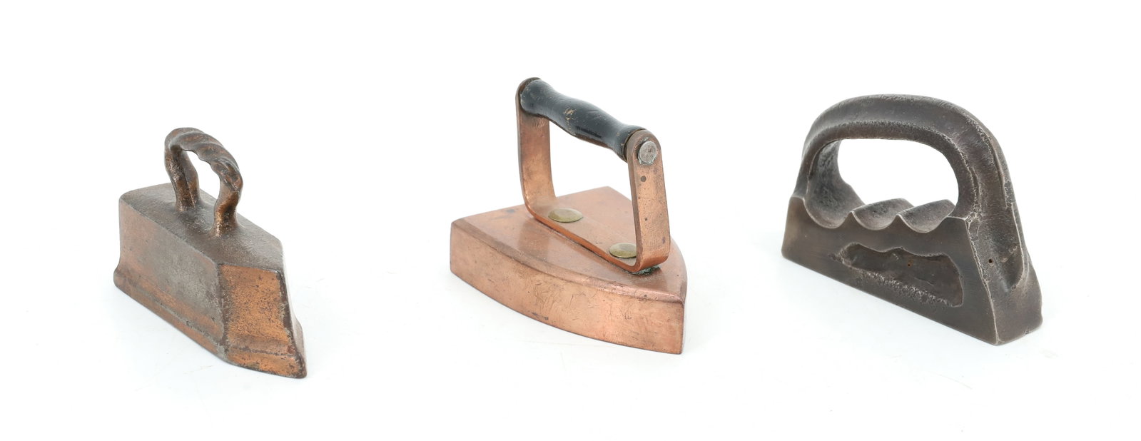 (3) MINIATURE PRESSING IRONS: SMALL SIZED POLISHING IRON WITH INTERESTING GRIP. SOLID COPPER BODY FLAT IRON W/ APPLIED HANDLE. TAILOR IRON W/ TWIST HANDLE. 2 3/4" L. PLEASE READ CAREFULLY - ITEMS MUST BE PAID FOR THROUGH LIVE AUCT