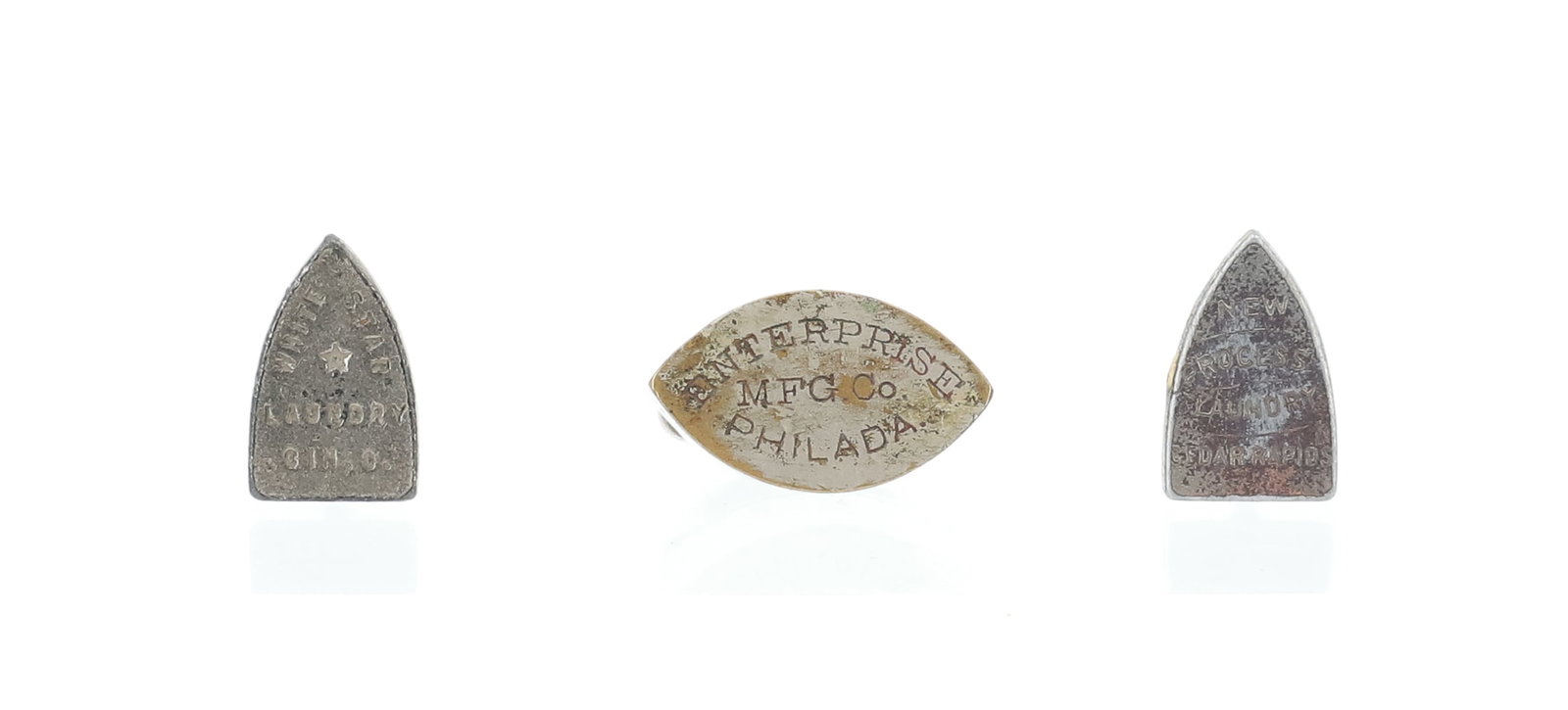 (3) MINIATURE ADVERTISING IRONS: FLAT IRON ADVERTISING "NEW PROCESS LAUNDRY, CEDAR RAPIDS". "WHITE STAR LAUNDRY, CINCINNATI, OHIO". DOUBLE-POINT "ENTERPRISE MFG. CO. PHILADELPHIA". 3/4" AND 7/16" LENGTHS. PLEASE READ CAREFULLY - ITEM