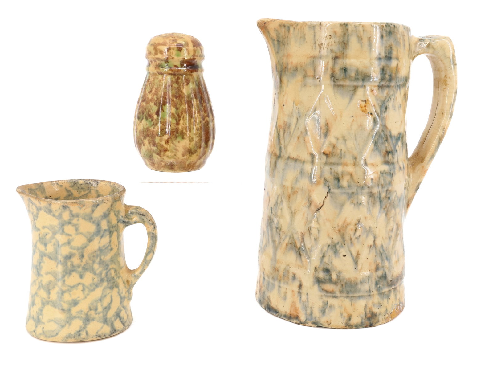 LOT OF SPONGEWARE POTTERY: INCLUDING; TALL PITCHER IN GREEN AND BROWN SPONGE, EMBOSSED SURFACE - 9"H - SMALL CREAMER, AND BROWN AND GREEN SPONGED SHAKER PLEASE READ CAREFULLY - ITEMS MUST BE PAID FOR THROUGH LIVE AUCTIONEERS OR