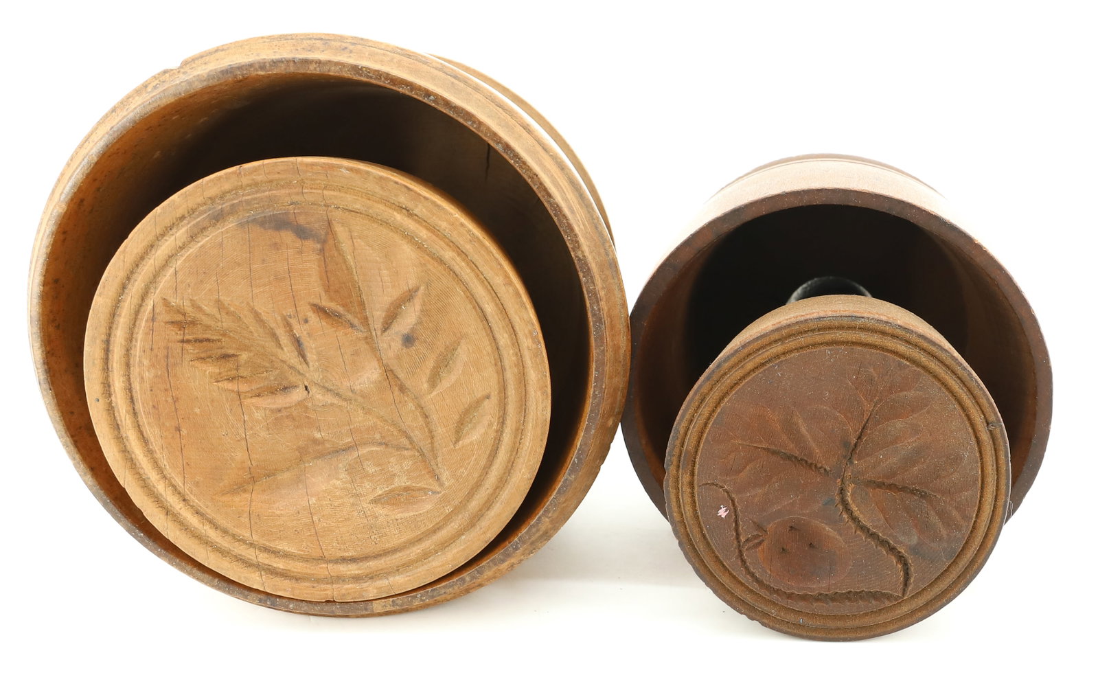 (2) CARVED WOODEN BUTTER MOLDS: ROUND TWO-PART BUTTER MOLDS WITH LEAF AND STRAWBERRY (3 3/4") AND OTHER WITH LEAF DESIGN PLEASE READ CAREFULLY - ITEMS MUST BE PAID FOR THROUGH LIVE AUCTIONEERS OR WITH CASH OR CHECK IN PERSON -