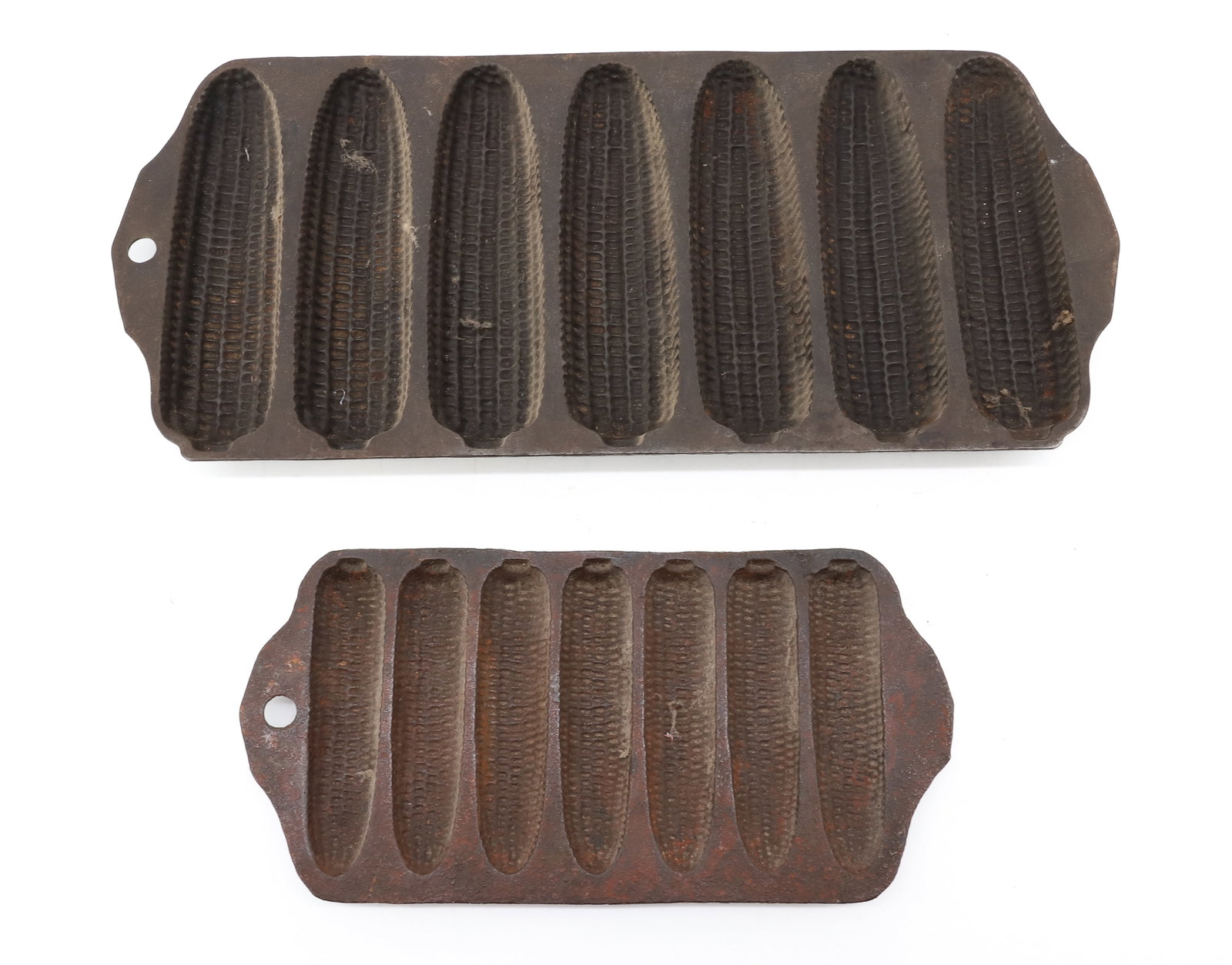 (2) CAST IRON GRISWOLD CORN MOLDS: SMALLEST MARKED; #252 "CRISPY CORN OR WHEAT STICK PAN" 8 1/2" L - LARGER MARKED; NO. 273 AND 930 A PLEASE READ CAREFULLY - ITEMS MUST BE PAID FOR THROUGH LIVE AUCTIONEERS OR WITH CASH OR CHECK IN