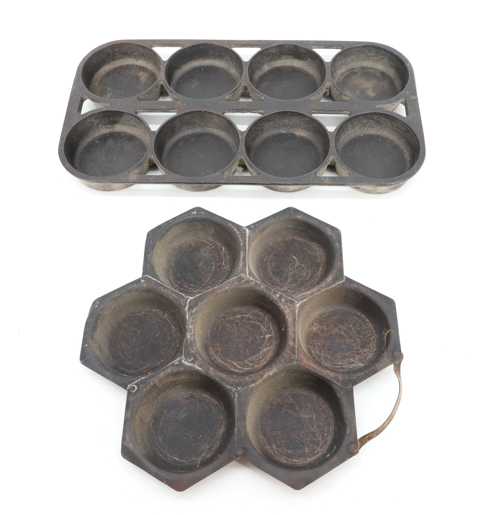 LOT OF (2) MUFFIN PANS: CAST IRON #8 MUFFIN PAN (12 3/4" X 6 7/8") - SHALLOW TIN MUFFIN PAN (UNMARKED) 9 1/4" X 9 1/4" PLEASE READ CAREFULLY - ITEMS MUST BE PAID FOR THROUGH LIVE AUCTIONEERS OR WITH CASH OR CHECK IN PERSON