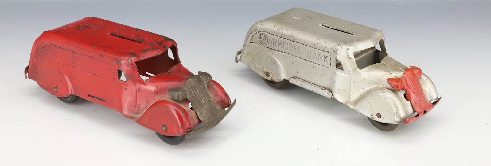 (2) PRESSED METAL TRUCK BANKS: PAINTED PRESSED METAL WITH WOODEN WHEELS, ONCE MARKED; ARMORED BANK BY; MARX 6" L PLEASE READ CAREFULLY - ITEMS MUST BE PAID FOR THROUGH LIVE AUCTIONEERS OR WITH CASH OR CHECK IN PERSON - Terms for Pu