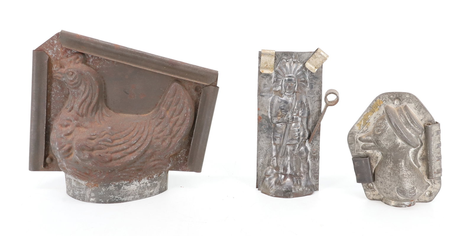 (3) ANTIQUE CHOCOLATE MOLDS: INCLUDING; HEN ON NEST 6 1/2" L, DUCKLING WITH HAT, AND INDIAN CHIEF 5 1/2" H PLEASE READ CAREFULLY - ITEMS MUST BE PAID FOR THROUGH LIVE AUCTIONEERS OR WITH CASH OR CHECK IN PERSON - Terms for