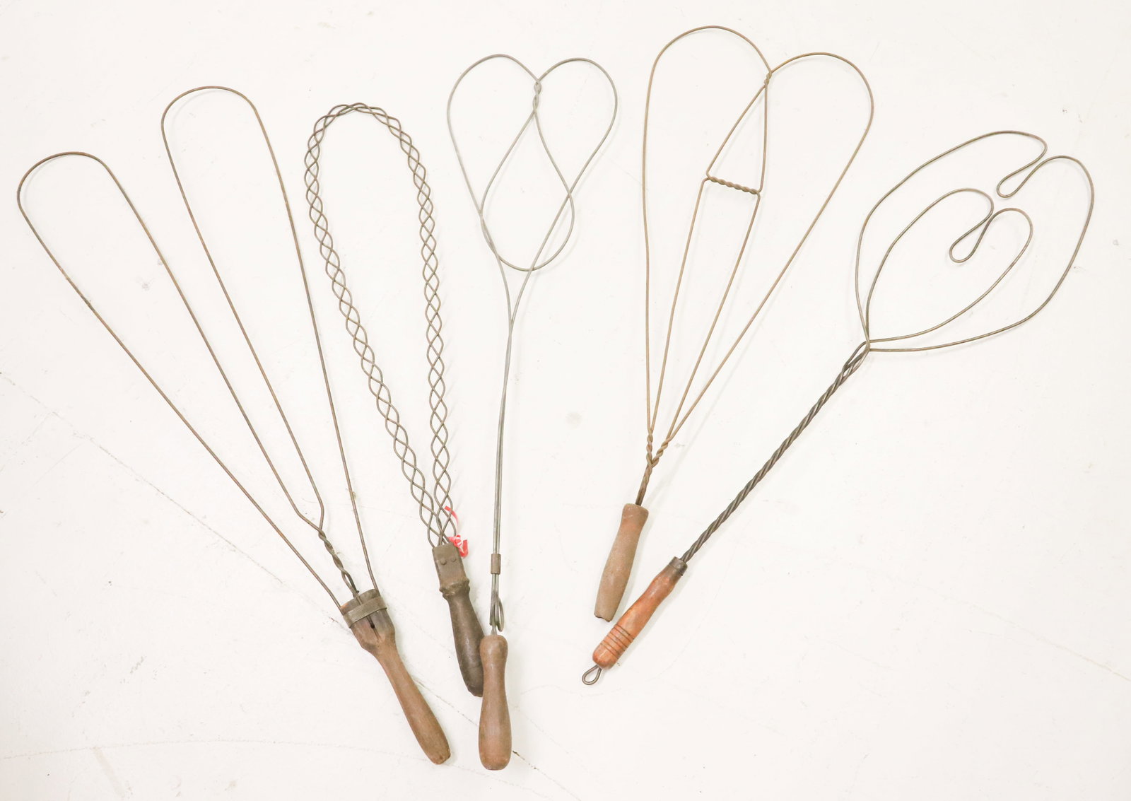 LOT OF (5) ANTIQUE CARPET BEATERS: UNUSUAL FORMS WITH WOODEN HAND GRIPS - LONGEST 34" PLEASE READ CAREFULLY - ITEMS MUST BE PAID FOR THROUGH LIVE AUCTIONEERS OR WITH CASH OR CHECK IN PERSON - Terms for Purchasing and Shipping of Auctio