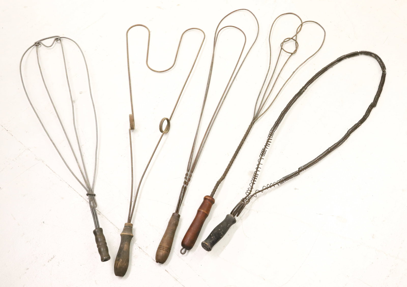 LOT OF (5) ANTIQUE CARPET BEATERS: UNUSUAL FORMS WITH WOODEN HAND GRIPS - LONGEST 32" PLEASE READ CAREFULLY - ITEMS MUST BE PAID FOR THROUGH LIVE AUCTIONEERS OR WITH CASH OR CHECK IN PERSON - Terms for Purchasing and Shipping of Auctio