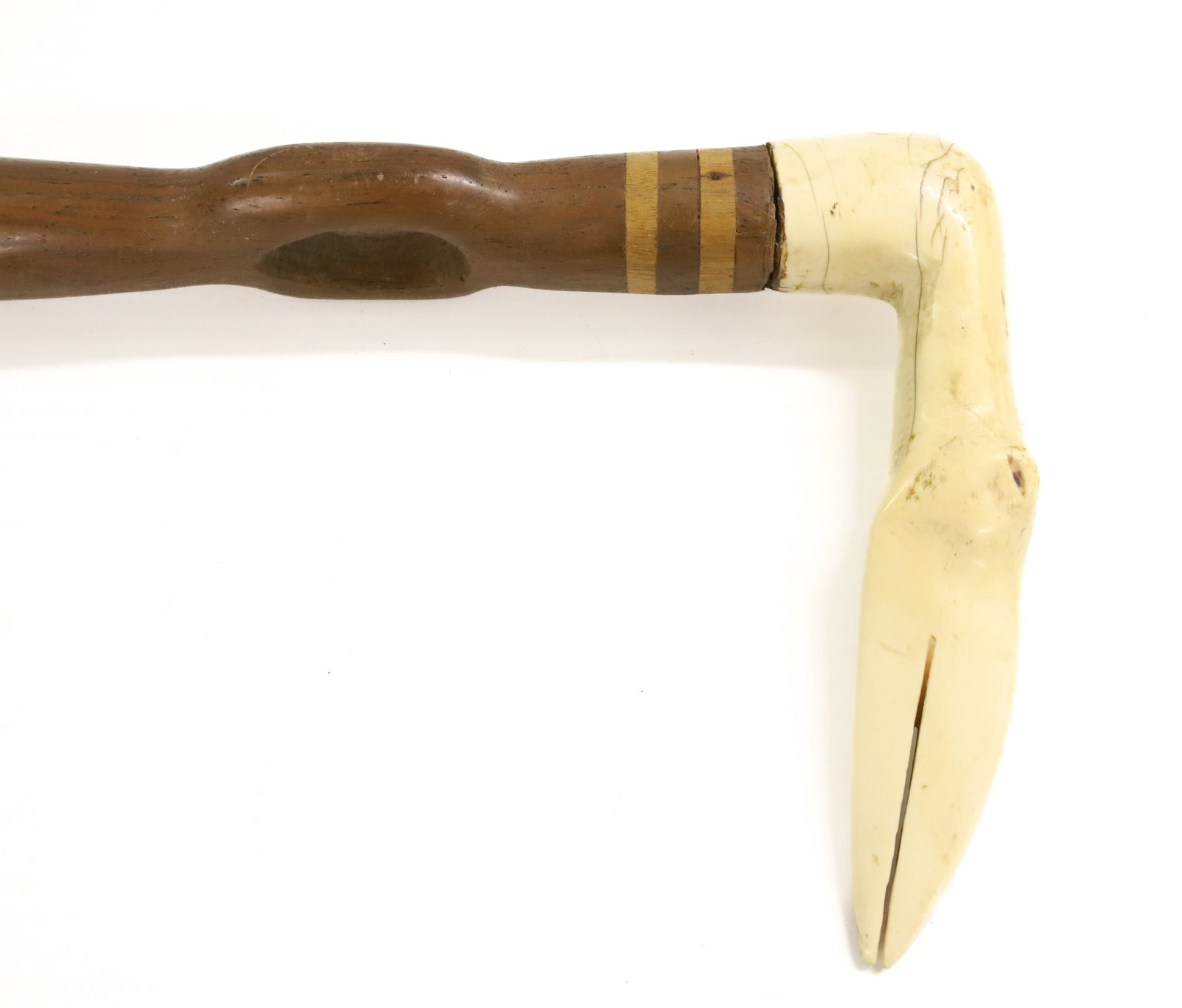 CARVED WOODEN CANE: BONE CARVED HANDLE IN FORM OF BIRD, CUTOUTS IN SHAFT - 37" L PLEASE READ CAREFULLY - ITEMS MUST BE PAID FOR THROUGH LIVE AUCTIONEERS OR WITH CASH OR CHECK IN PERSON - Terms for Purchasing and Shipping