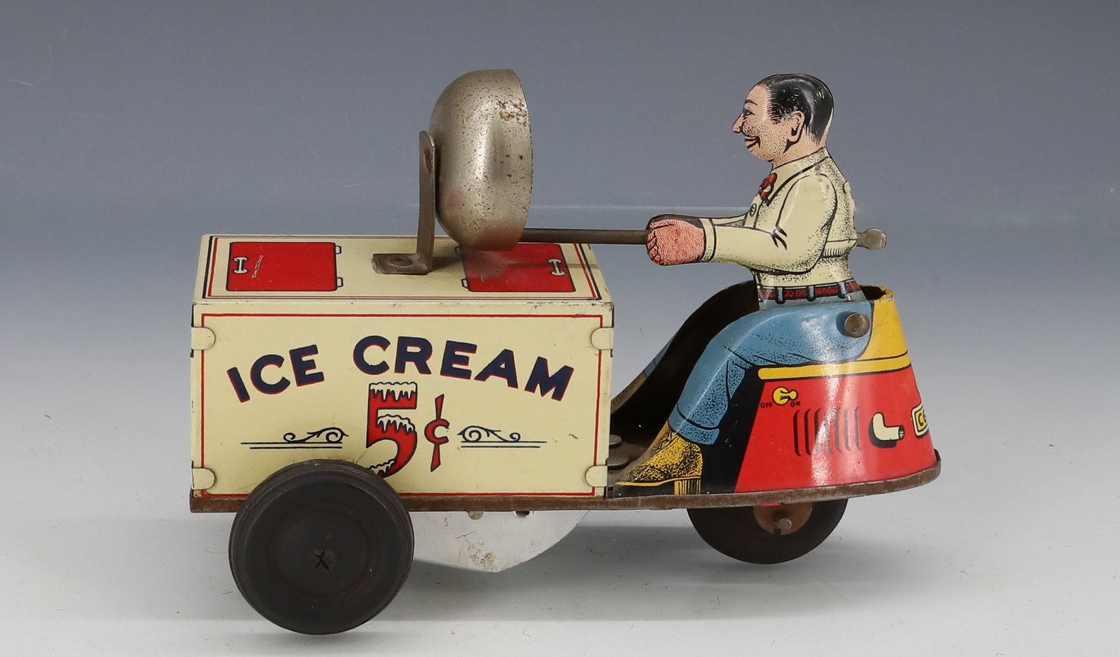 TIN LITHO COURTLAND "ICE CREAM" TRUCK: WINDUP TIN LITHO WITH DRIVER WHO RINGS BELL. 6 1/2" L. PLEASE READ CAREFULLY - ITEMS MUST BE PAID FOR THROUGH LIVE AUCTIONEERS OR WITH CASH OR CHECK IN PERSON - Terms for Purchasing and Shipping of Au