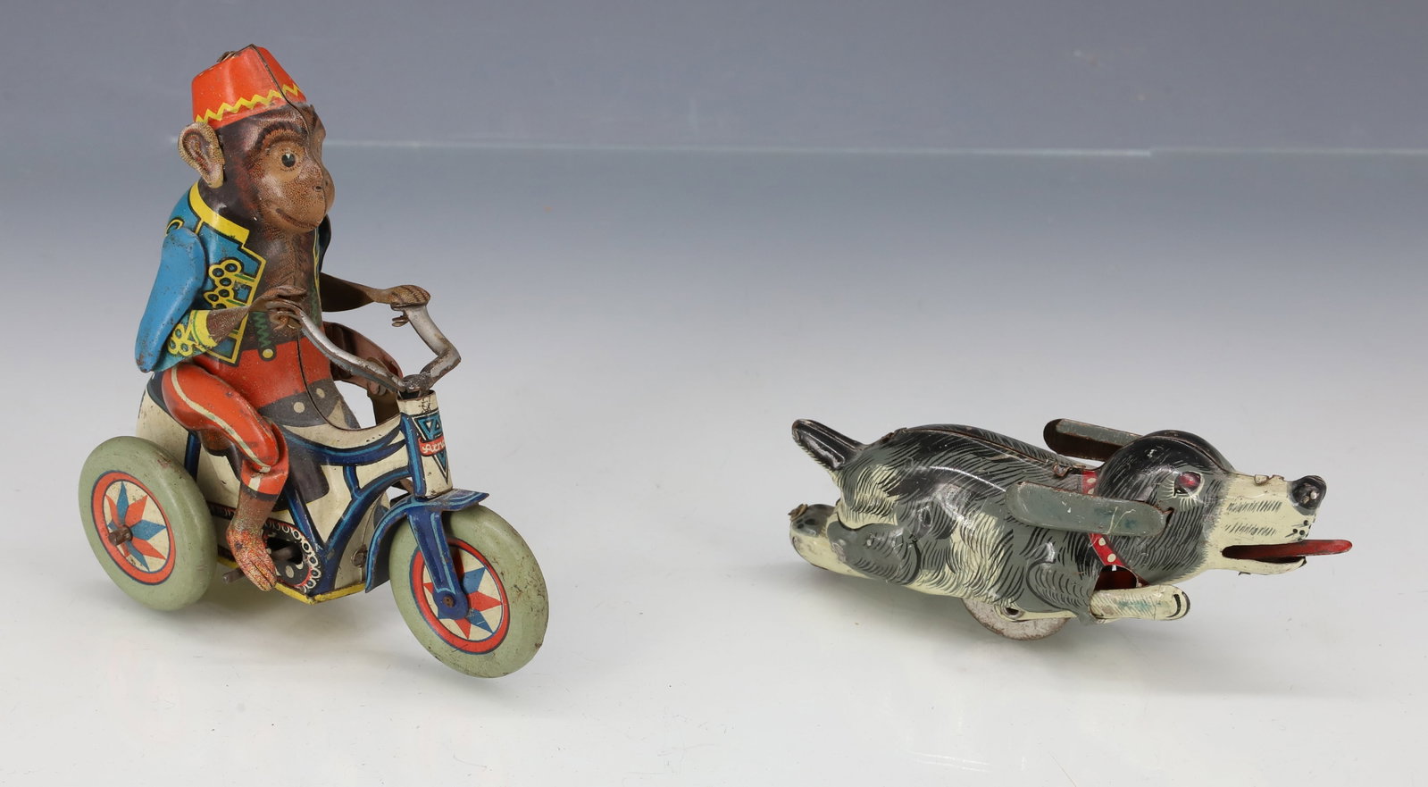 TIN LITHO MONKEY ON TRICYCLE AND DOG (1 of 4)
