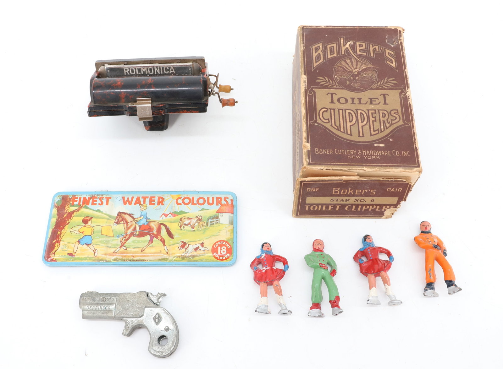 LOT OF VINTAGE TOYS: TIN LITHO OF WATER COLORS, ROLMONICA / HARMONICA, TOY DERRINGER, PAINTED METAL SKATERS AND "BOKER'S TOILET CLIPPERS" IN ORIGINAL BOX. PLEASE READ CAREFULLY - ITEMS MUST BE PAID FOR THROUGH LIVE AUCTIO