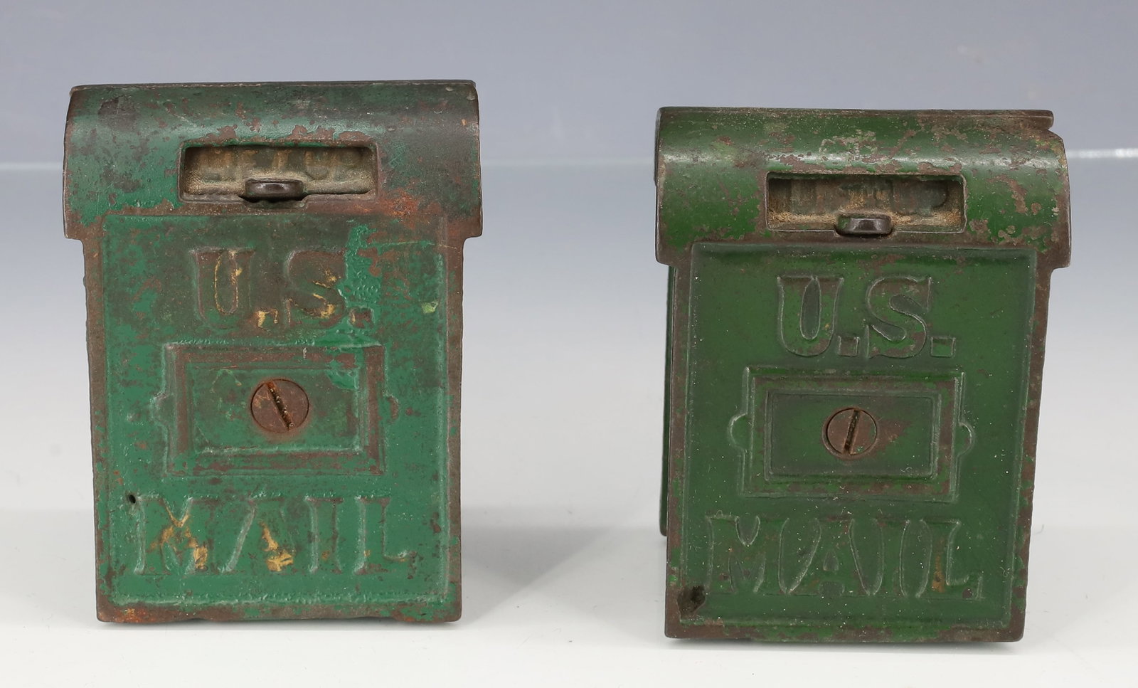 (2) U.S. MAIL BANKS: GREEN PAINTED. 3 1/2" X 2 3/4". PLEASE READ CAREFULLY - ITEMS MUST BE PAID FOR THROUGH LIVE AUCTIONEERS OR WITH CASH OR CHECK IN PERSON - Terms for Purchasing and Shipping of Auction Items. Please rea