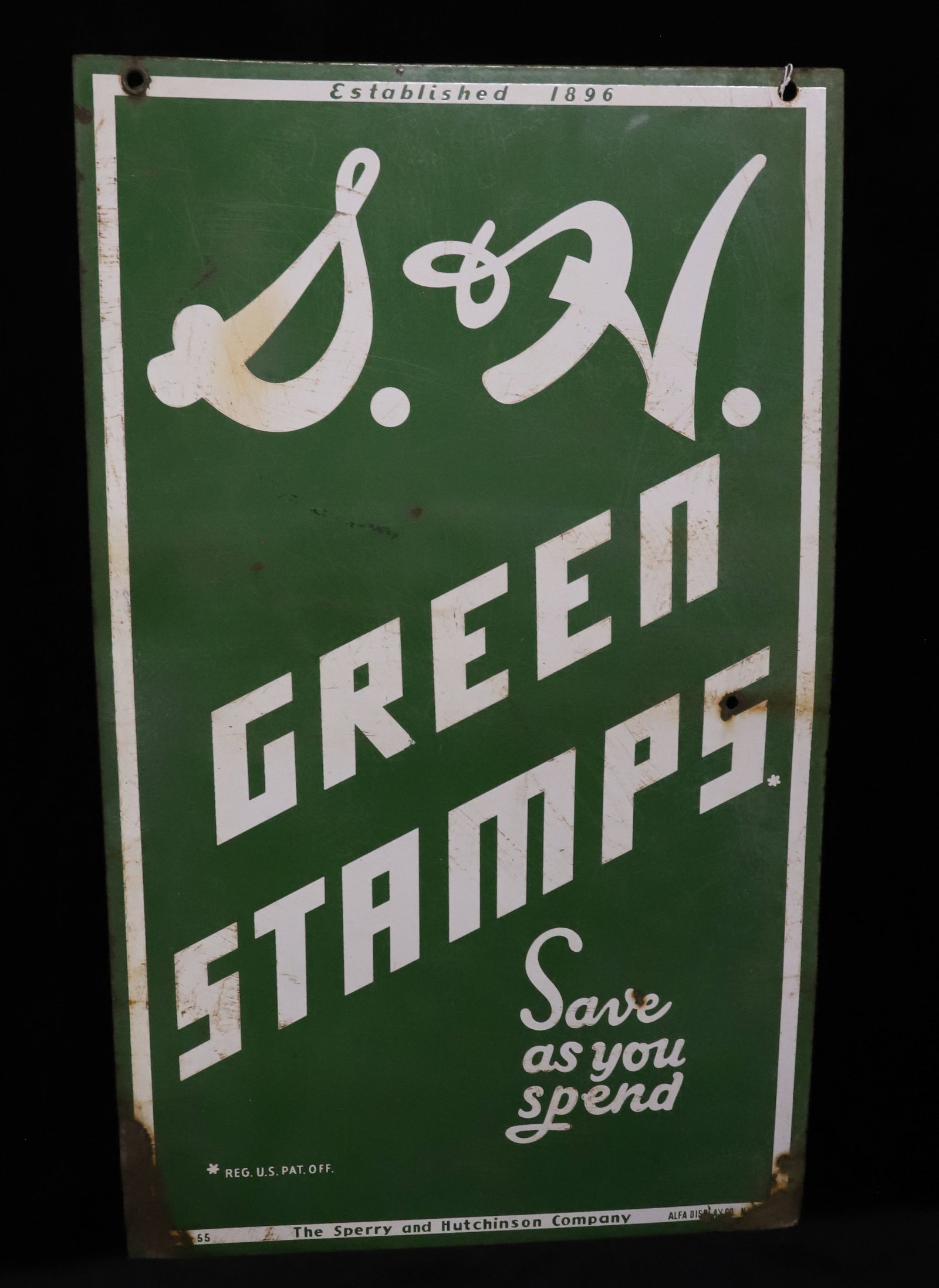 "S. & H. GREEN STAMPS" PORCELAIN ADVERTISING SIGN: GREEN / WHITE DOUBLE-SIDED "SAVE AS YOU SPEND, THE SPERRY AND HUTCHINSON COMPANY" 33" X 20". PLEASE READ CAREFULLY - ITEMS MUST BE PAID FOR THROUGH LIVE AUCTIONEERS OR WITH CASH OR CHECK IN PERSON - T