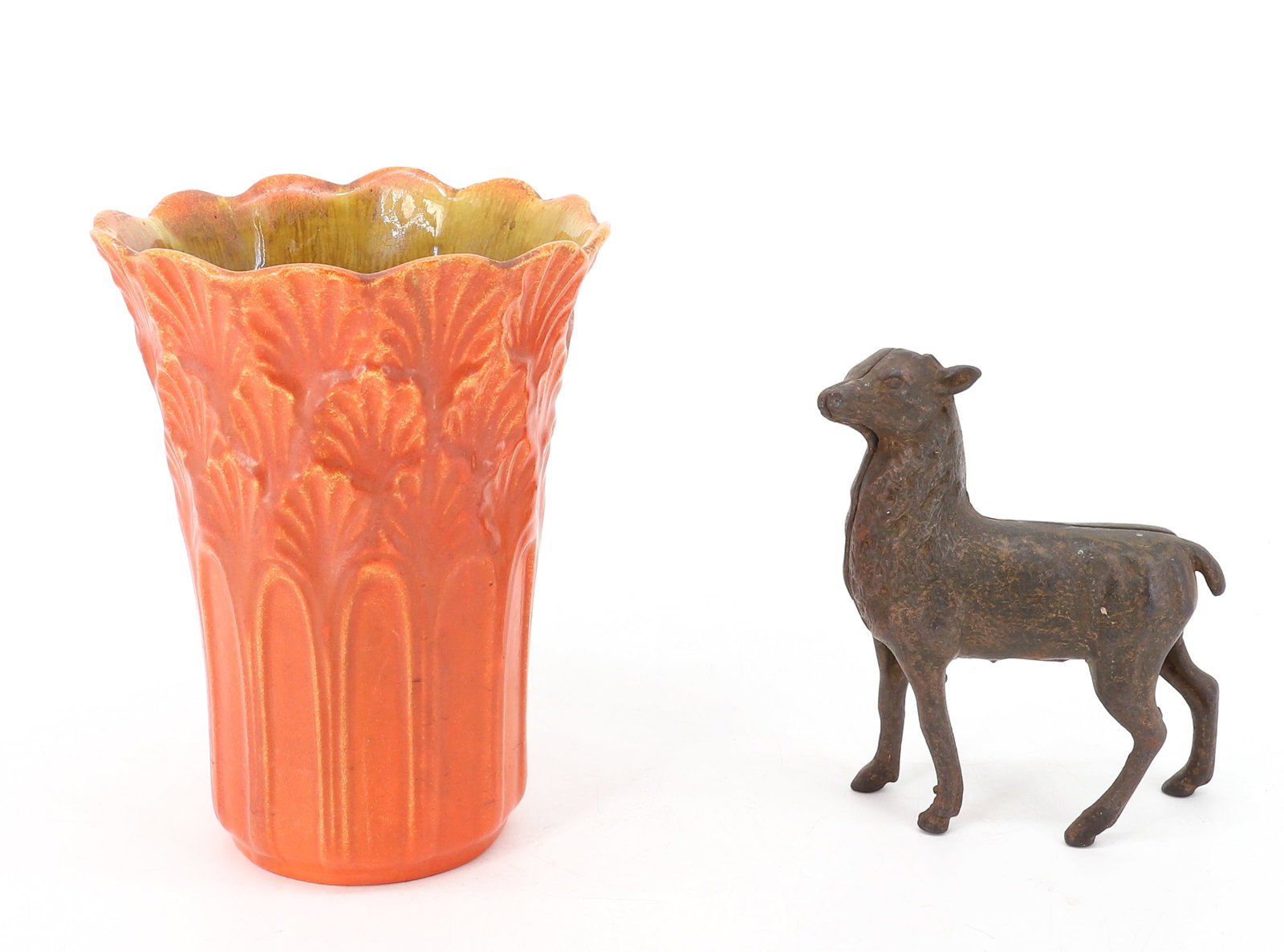 STANGL VASE AND CAST IRON STILL BANK: EMBOSSED ORANGE GLAZE "STANGL" VASE 6 1/2" H. WITH, CAST IRON STILL BANK. TRACES OF ORIGINAL PAINT. 5" X 4". PLEASE READ CAREFULLY - ITEMS MUST BE PAID FOR THROUGH LIVE AUCTIONEERS OR WITH CASH OR CHE
