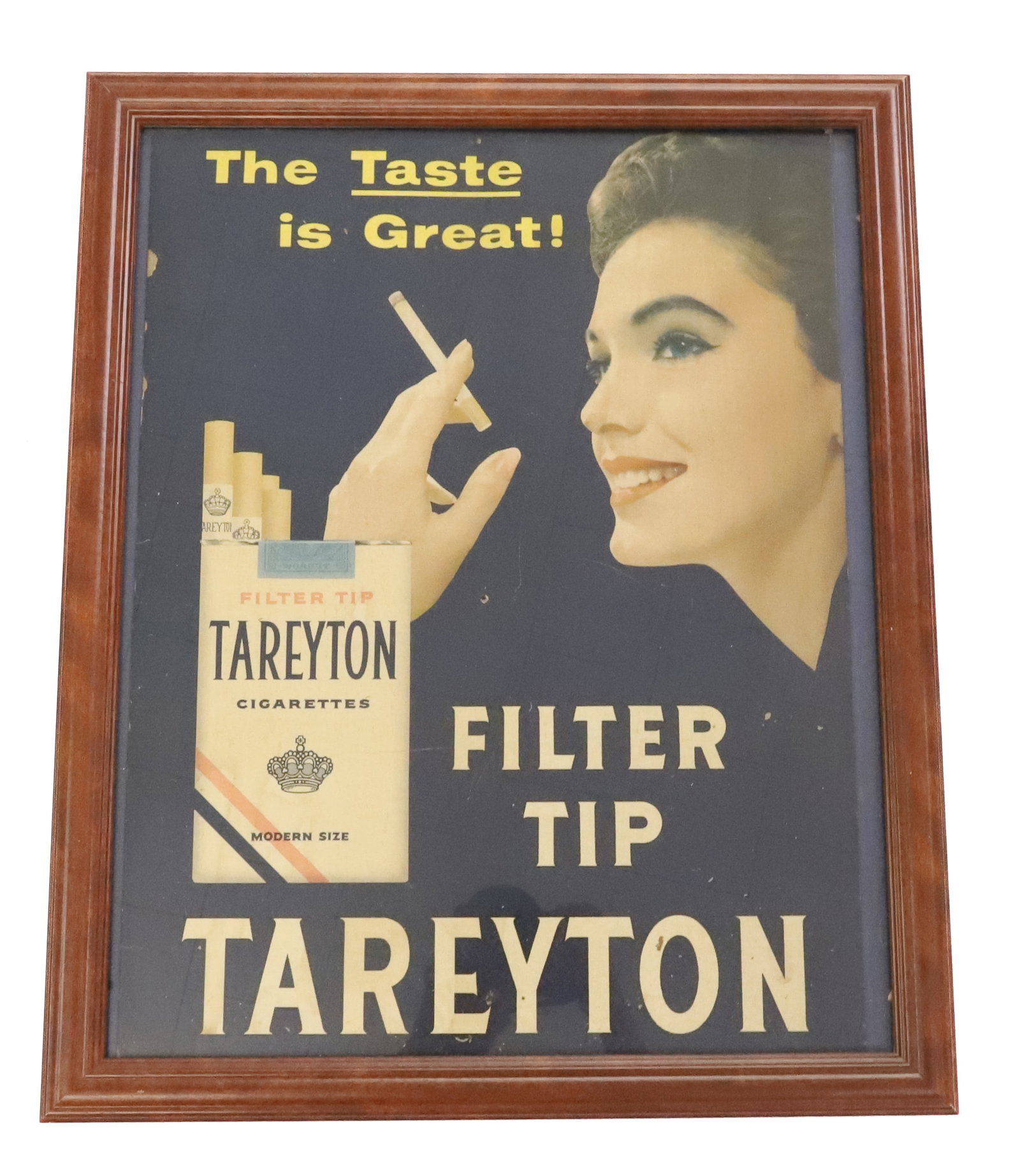 "TAREYTON CIGARETTES" FRAMED PAPER ADVERTISER: "THE TASTE IS GREAT" PAPER LITHO IN CONTEMPORARY FRAME. SIGN IS 19 1/2" X 14 3/4". PLEASE READ CAREFULLY - ITEMS MUST BE PAID FOR THROUGH LIVE AUCTIONEERS OR WITH CASH OR CHECK IN PERSON - Terms for P